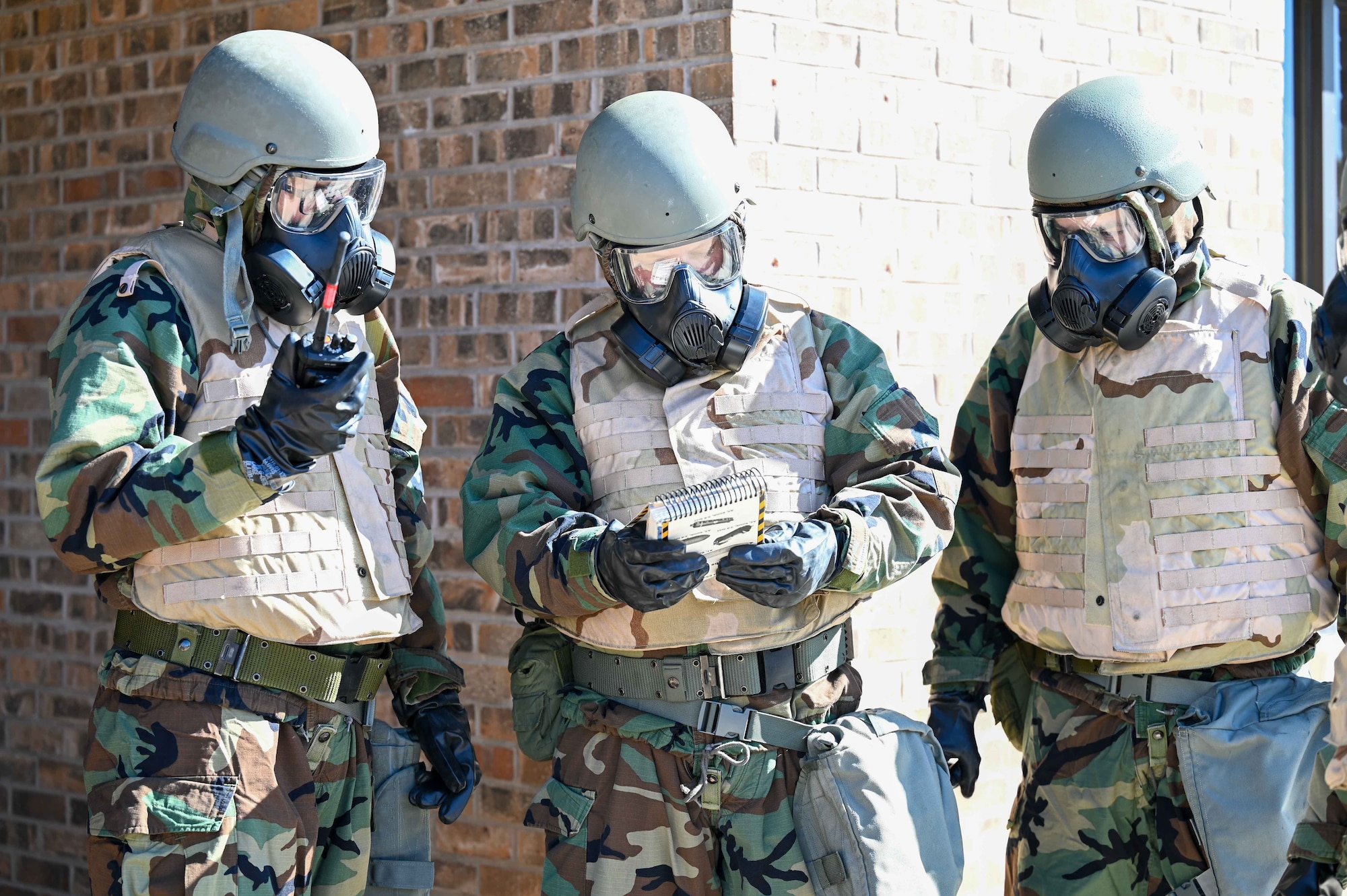 From left, U.S. Air Force 1st Lt. Alexander Franco, 97th Communications Squadron (CS) quality assurance officer in charge, 1st Lt. Edward Sheridan, 97 CS communications help desk officer in charge, and Lt. Col. Colby Arends, 97 CS commander, discuss their plan of attack during a readiness exercise at Altus Air Force Base, Oklahoma, Feb. 23, 2023. The exercise supported the Air Force Force Generation model to ensure units are prepared for deployments and sending out multi-capable Airmen. (U.S. Air Force photo by Airman 1st Class Kari Degraffenreed)