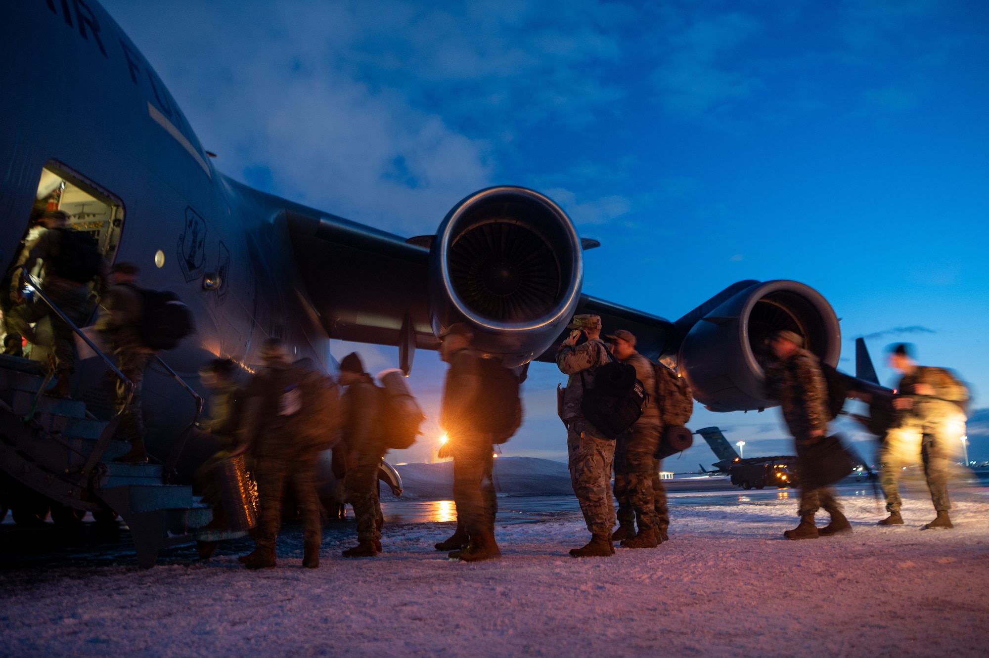 A photo of Airmen loading onto a C-17
