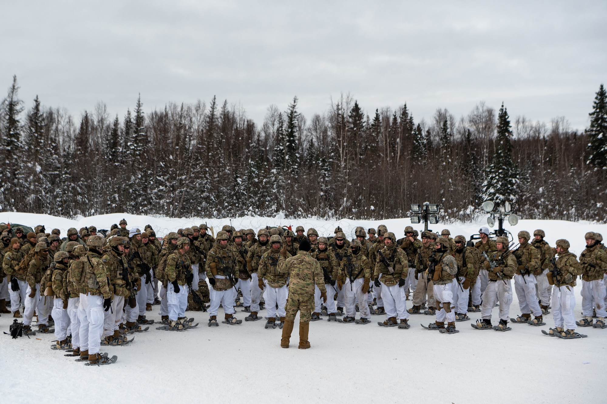A photo of a large group of Soldiers circled up for a safety brief