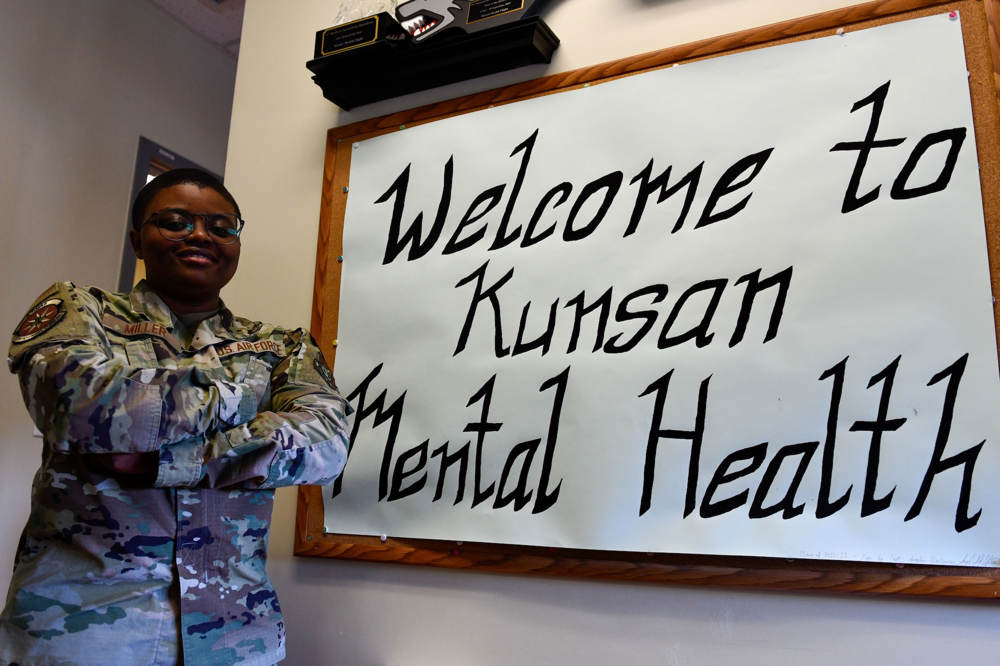Staff Sgt. Tommia Miller, 8th Operational Medical Readiness Squadron mental health technician, poses in front of an office mural on Kunsan Air Base, Republic of Korea, Mar. 2, 2023. Mental health technicians help ensure service members and their families are in the right mental space to complete their mission and can provide resources if they are struggling. (U.S. Air Force photo by Tech. Sgt. Timothy Dischinat).