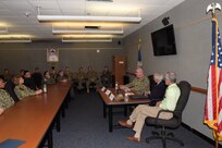 Cmdr. Michael Margolius, director of operations for the Joint Personnel Recovery Agency (JPRA), spoke as one of the guest speakers to naval aerospace medical professionals about the lessons learned during personnel recovery operations, during the Robert E. Mitchell Center (REMC) for Prisoner of War Studies observance for the 50th anniversary of Operation Homecoming held on Corry Station, Mar. 1, 2023.