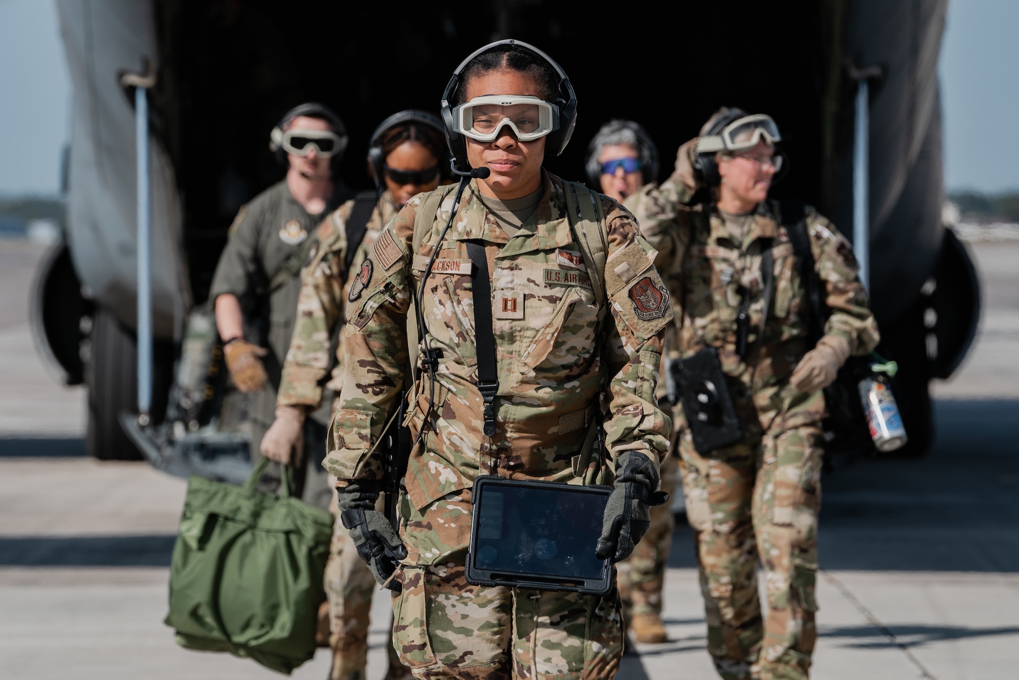 Airmen assigned to the 45th Aeromedical Evacuation Squadron participate in an evacuation operation at MacDill Air Force Base, Florida, Dec 5, 2022. This exercise simulated a deployment setting and enhanced the capabilities of the Airmen to rescue wounded warriors from the battlefield with an aircraft’s engines running. (U.S. Air Force photo by Senior Airman Joshua Hastings)