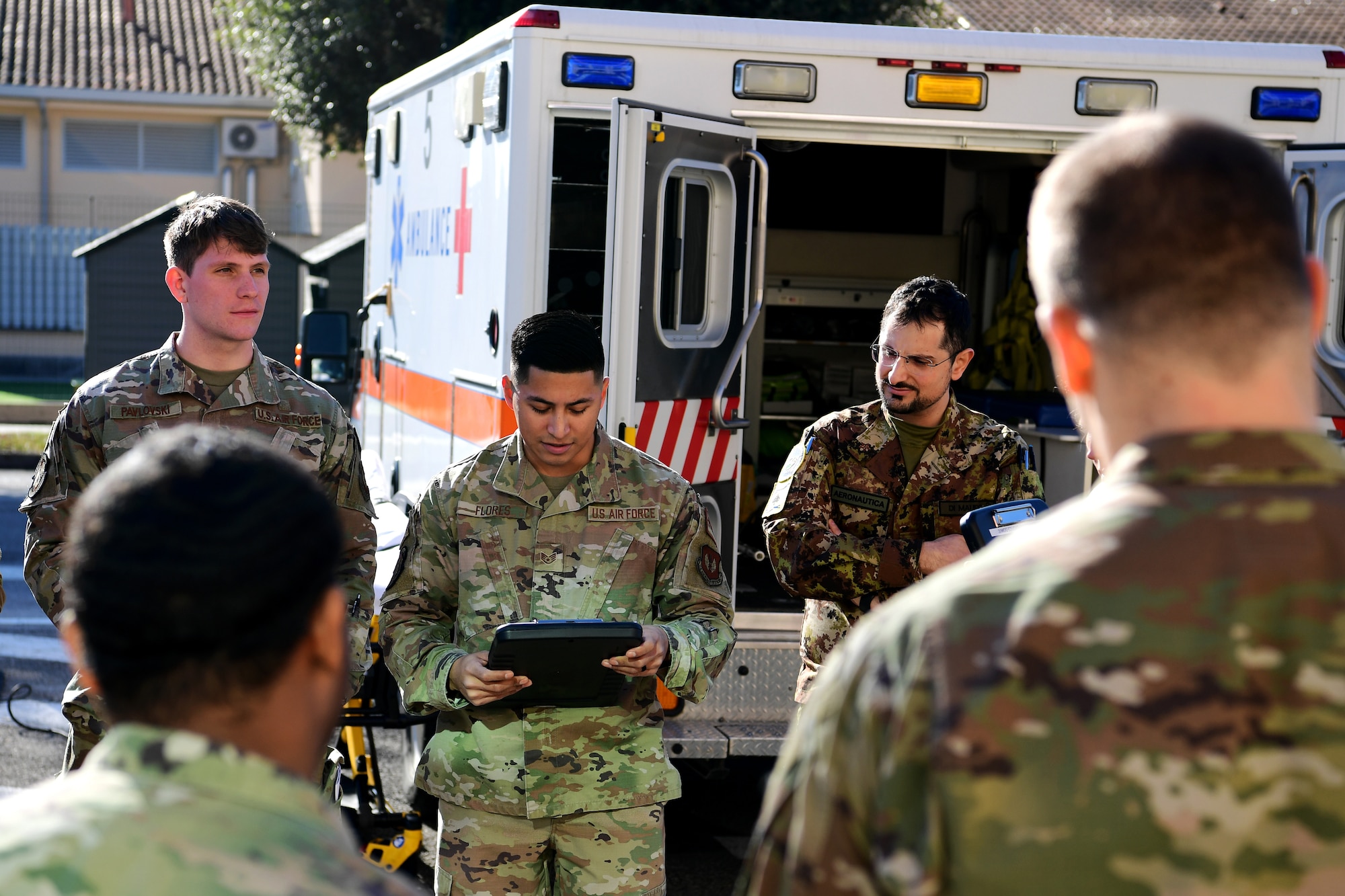 U.S. Airmen from the 31st Medical Group and Italian Air Force medical personnel simulate transporting injured patients during a joint training event at Aviano Air Base, Italy, Feb. 14, 2023.