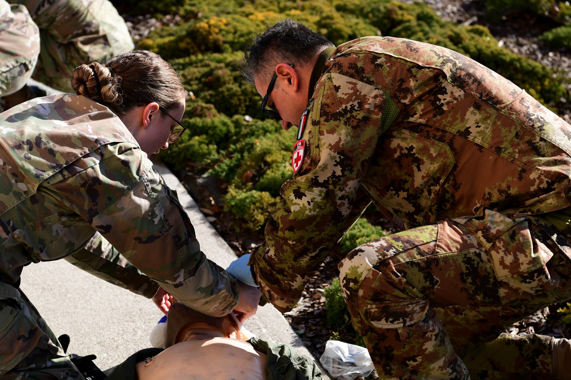 U.S. Airmen from the 31st Medical Group and Italian Air Force medical personnel simulate transporting injured patients during a joint training event at Aviano Air Base, Italy, Feb. 14, 2023.