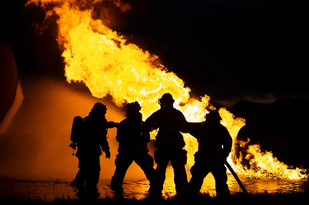 Firefighters put out a fire during fire training