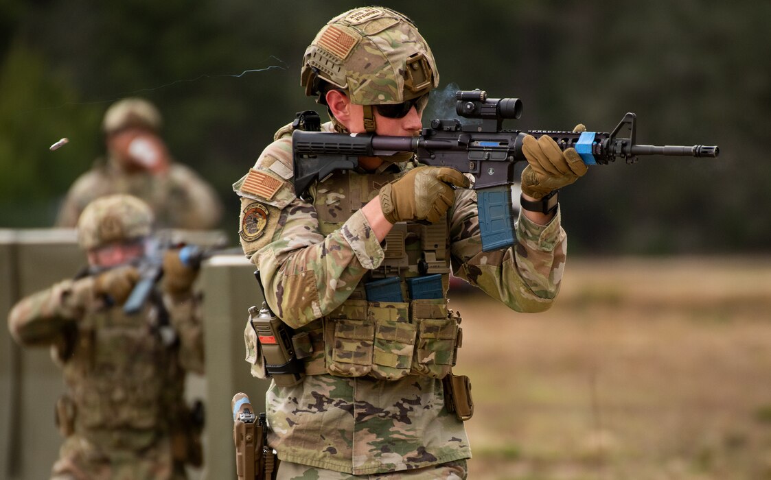 Senior Airman fires a round at a target