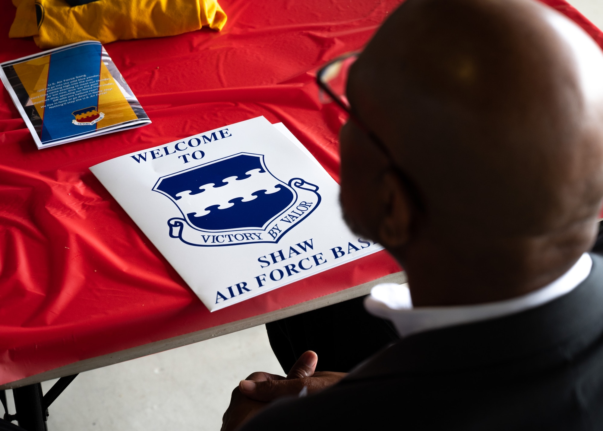 Barney Gadson receives orientation brief at Honorary Commander Ceremony