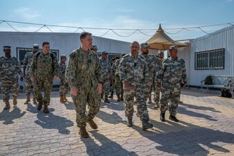 Vice Adm. Brad Cooper walks with senior leaders from the Yemen coast guard during a visit to Al Ghaydah, Yemen.