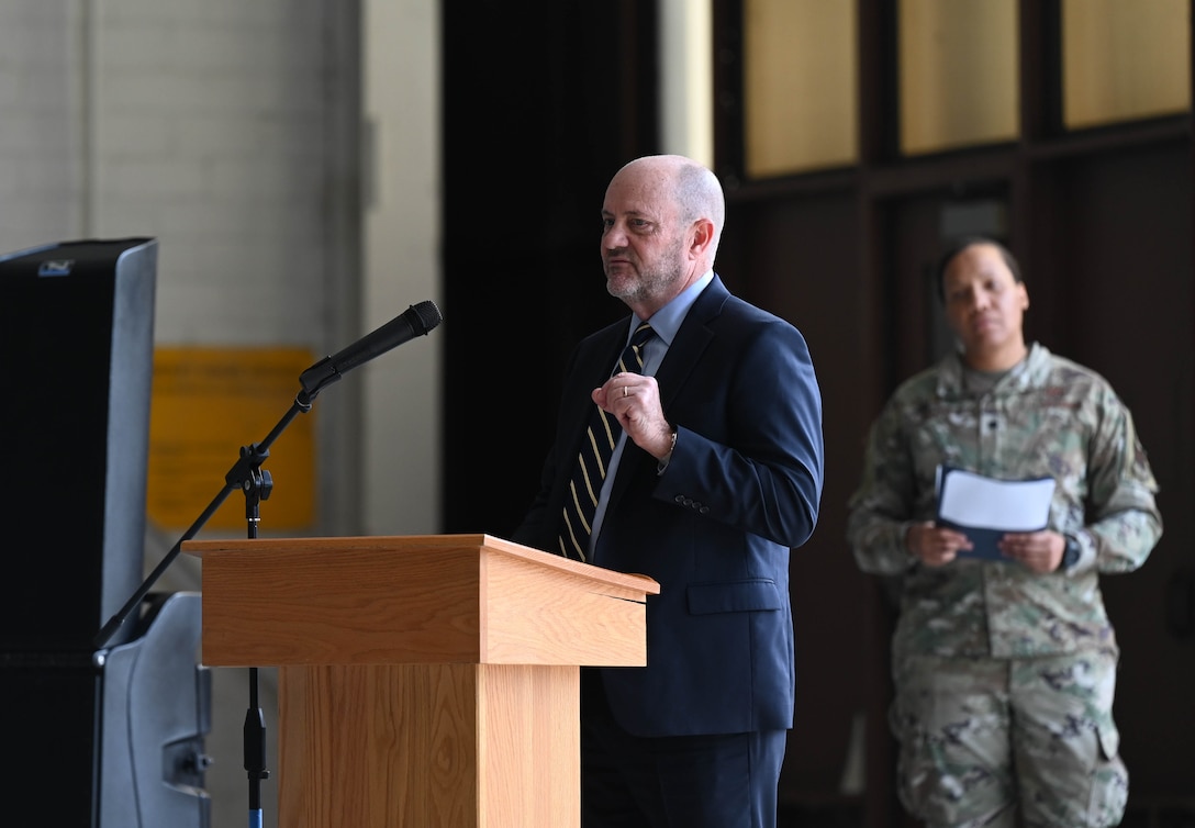 Richard Hammett, design firm representative, celebrates the F-22 Consolidation Operations Maintenance Hanger project at Joint Base Langley-Eustis, Virginia, Feb. 22, 2023.