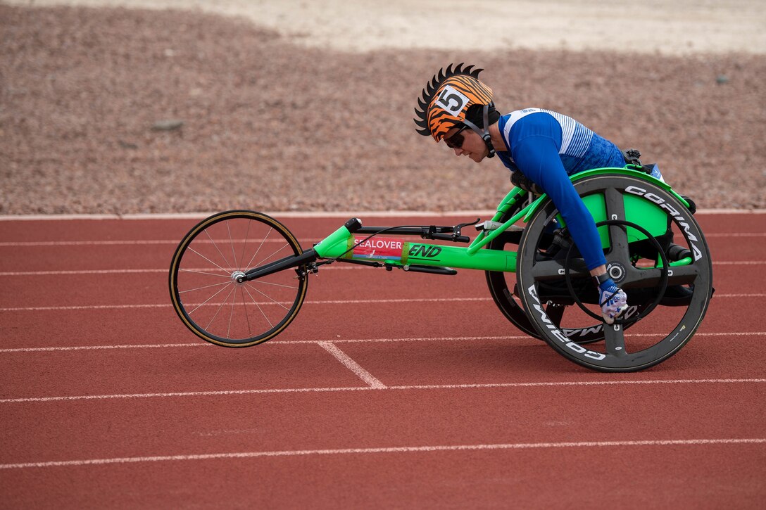 An athlete races in a handcycle.