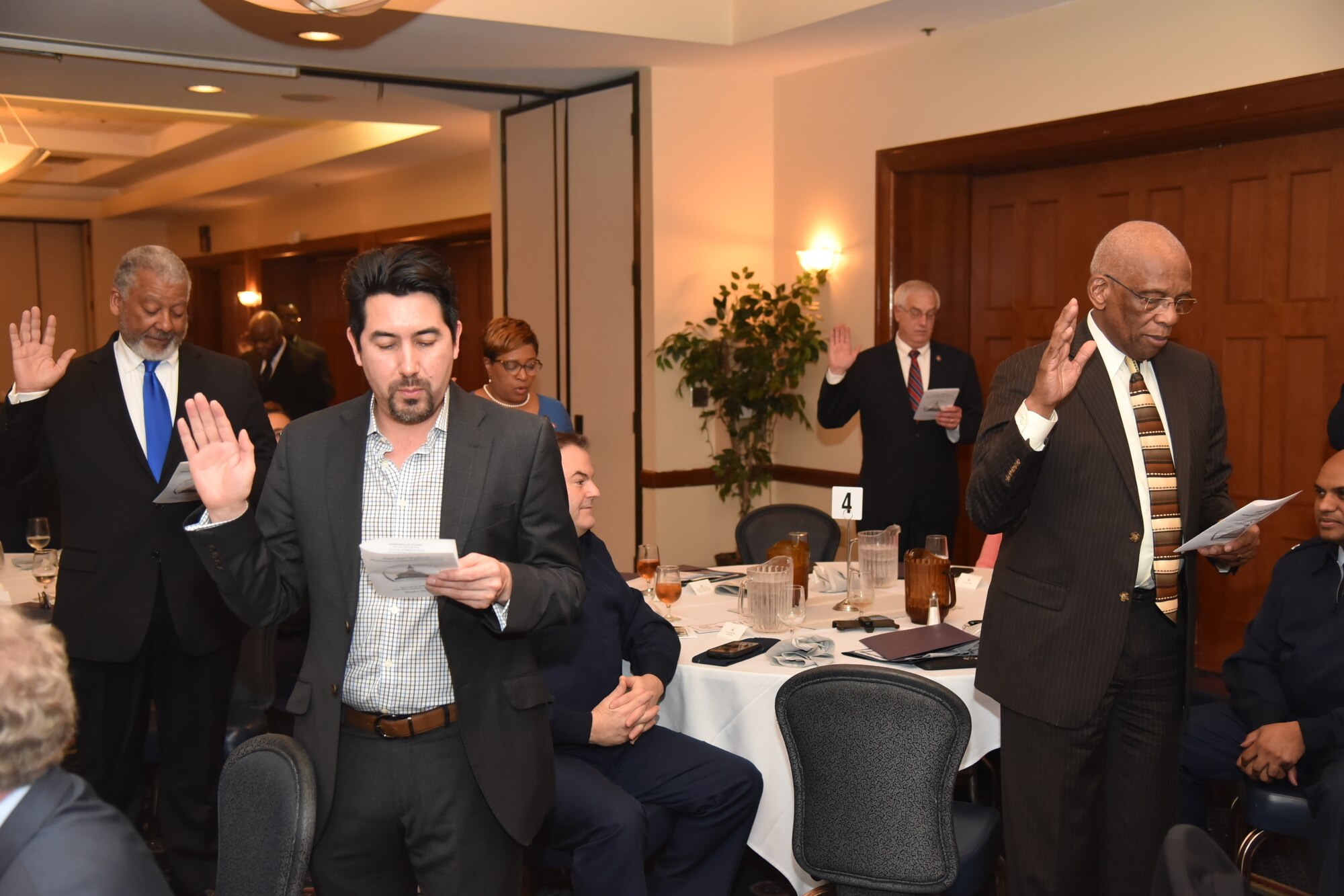 Civilian leaders recite the Honorary Commander Oath during an induction ceremony at Joint Base Andrews, Md., March 2, 2023. The program has been in existence for almost 20 years to allow communication and partnerships between key leaders of the base and surrounding community. (Photo courtesy of Patrick Griffith)