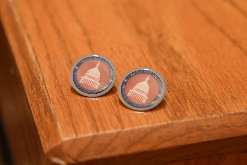 Lapel pins sit on a table.