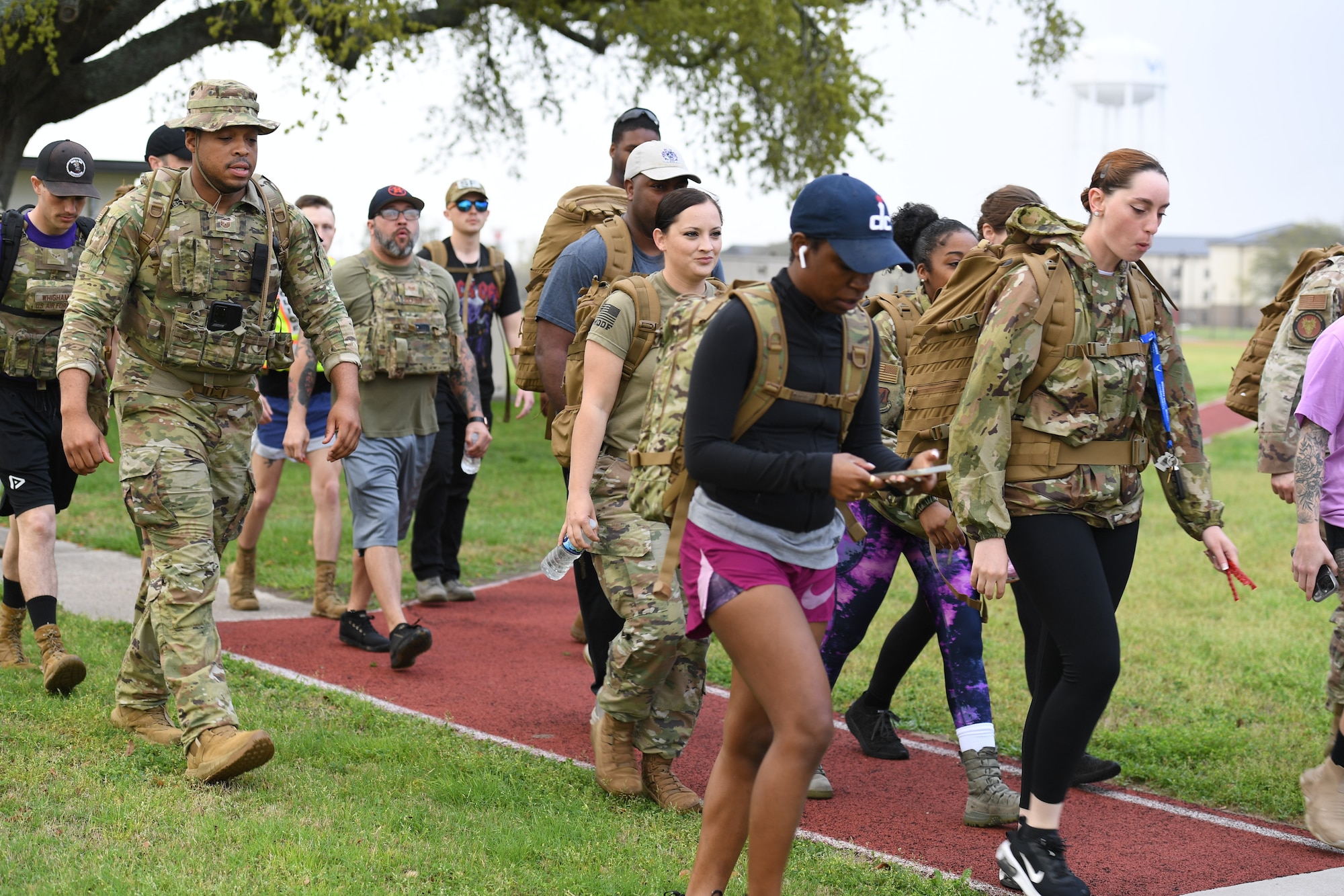 Members of the 81st Security Forces Squadron participate in the 5K Beauty and Boots Ruck March at Keesler Air Force Base, Mississippi, March 3, 2023.