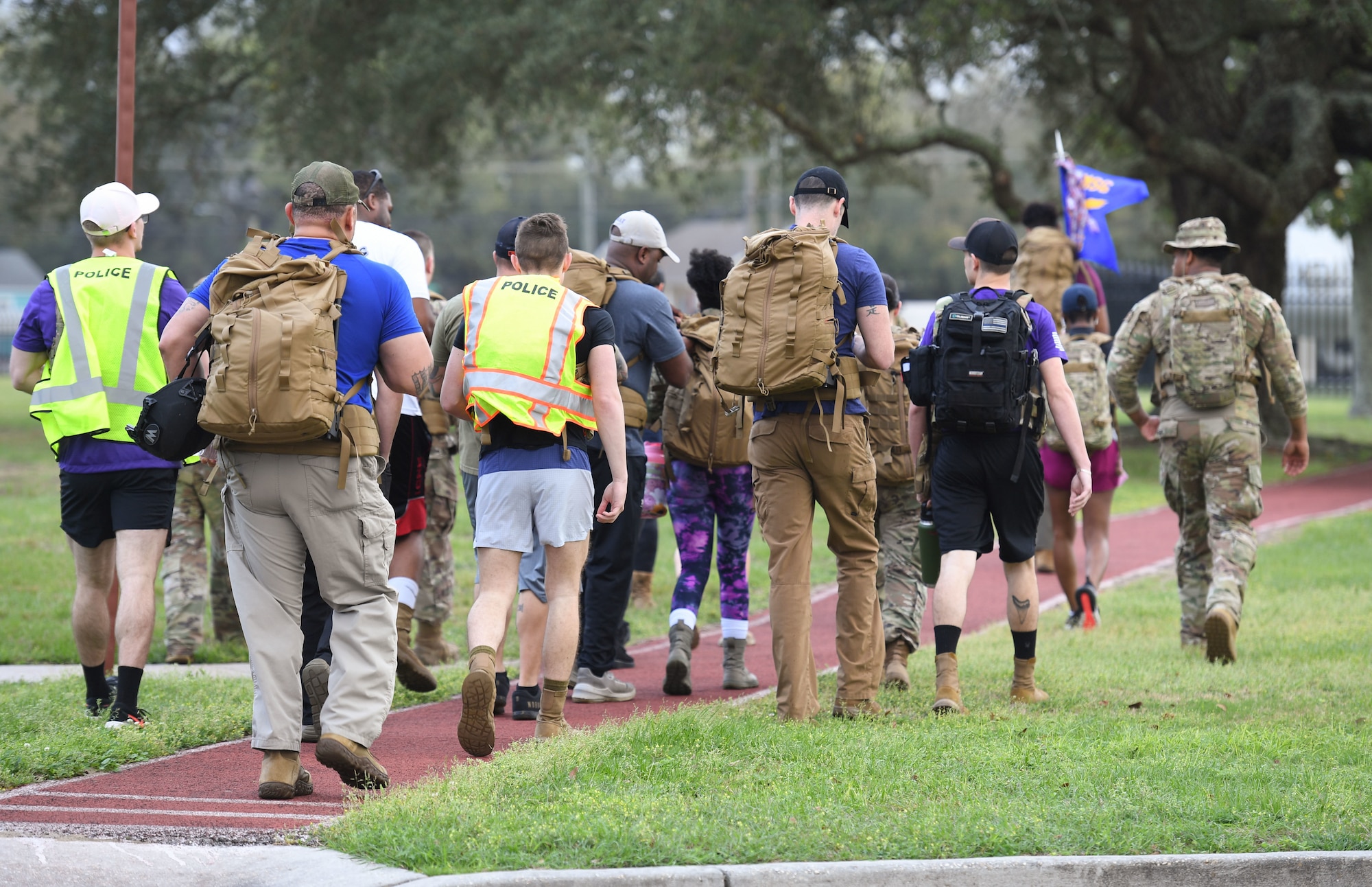 Members of the 81st Security Forces Squadron participate in the 5K Beauty and Boots Ruck March at Keesler Air Force Base, Mississippi, March 3, 2023.
