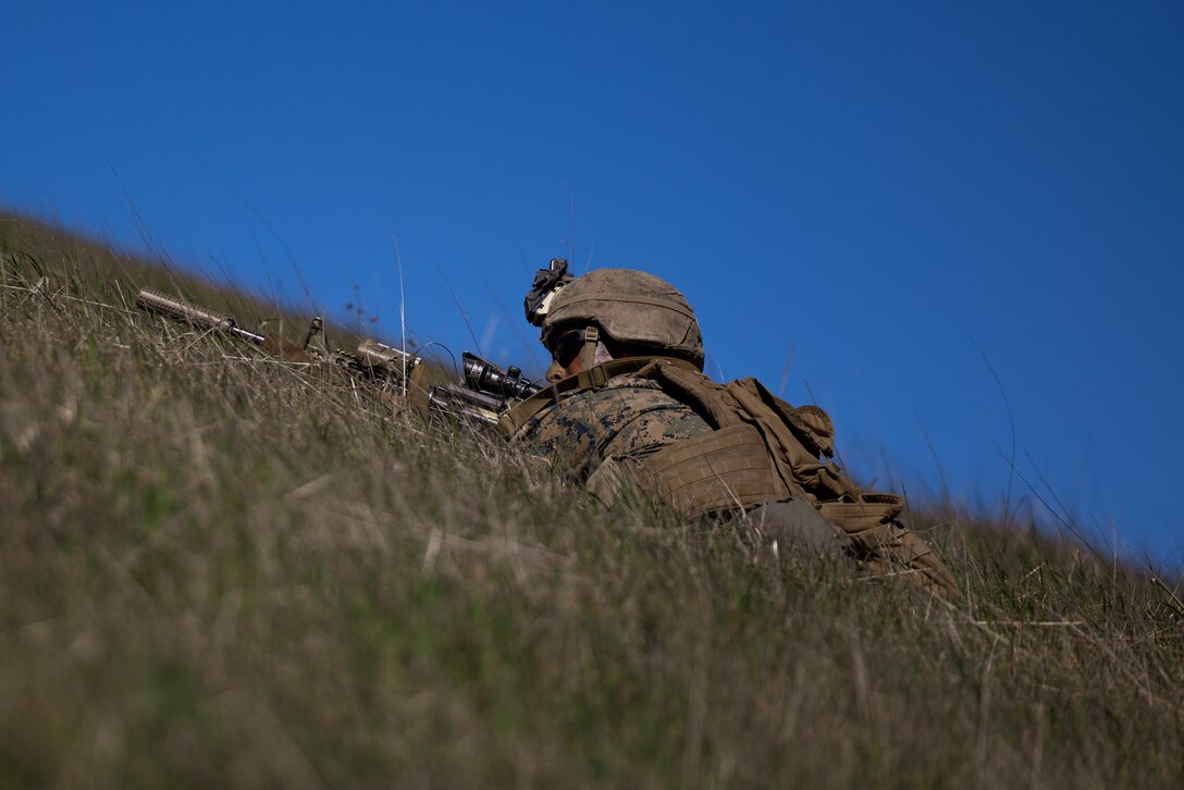 A U.S. Marine with Bravo Company, 1st Light Armored Reconnaissance Battalion, 1st Marine Division, posts security during the annual 1st MARDIV squad competition on Marine Corps Base Camp Pendleton, California, Feb. 7, 2023. The week-long squad competition incorporates a variety of combat-related tasks designed to evaluate each squad’s proficiency. (U.S. Marine Corps photo by Lance Cpl. Earik Barton)