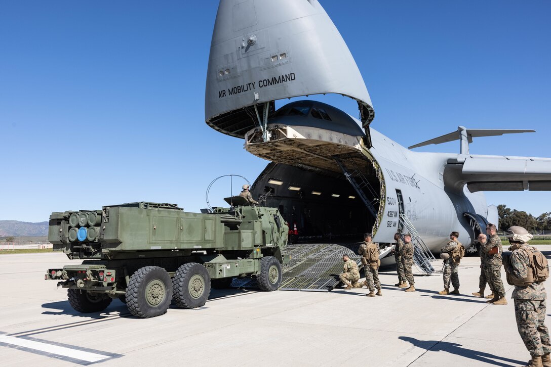 U.S. Marines with 5th Battalion, 11th Marine Regiment, 1st Marine Division, drive an M142 High Mobility Artillery Rocket System onto a U.S. Air Force C-5 Galaxy during a loading exercise at Marine Corps Air Station Camp Pendleton, California, Feb. 7, 2023.  Marines with the battalion conducted the exercise in order to rehearse the planning and execution of embarking a self-sustaining platoon on a C-5. (U.S. Marine Corps photo by Cpl. Cameron Hermanet)