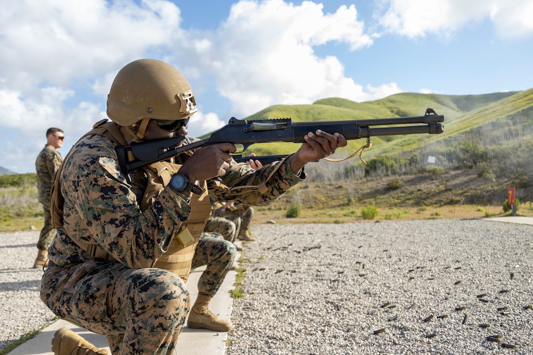 U.S. Marine Corps 2nd Lt. John Kelley, an air support control officer with Marine Air Support Squadron (MASS) 3, Marine Air Control Group 38, 3rd Marine Aircraft Wing, grabs ammunition before shooting an M1014 shotgun on range 112A, Camp Pendleton, California, Feb. 22, 2023. More than 100 Marines from MASS-3 honed their weapons skills with the M1014 combat shotgun. Marines from various military occupational specialties received hands-on experience to improve marksmanship and become well-rounded war fighters. Kelley is a Quantico, Virginia, native. (U.S. Marine Corps photo by Cpl. Daniel Childs)