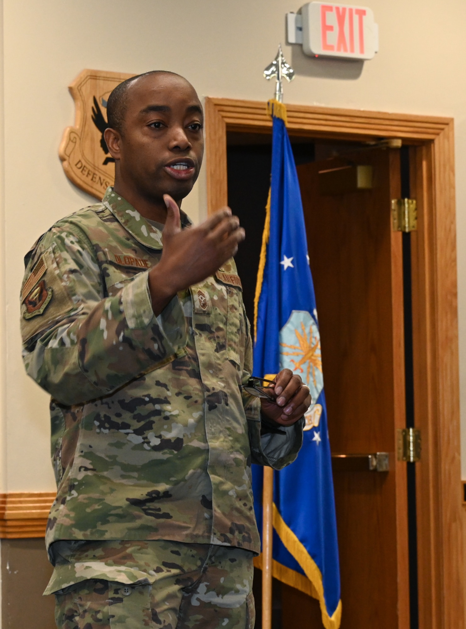 Chief Master Sgt. Olatokunbo Olopade, 509th Bomb Wing command chief, talks to 509th Bomb Wing Airmen about ways Airmen can use the Air Force Assistance Fund at Whiteman Air Force Base, Mo., March 3, 2023. Olopade covered reasons the Air Force Assistance Fund can and has helped Airmen. (U.S. Air Force photo by Senior Airman Nash Truitt)