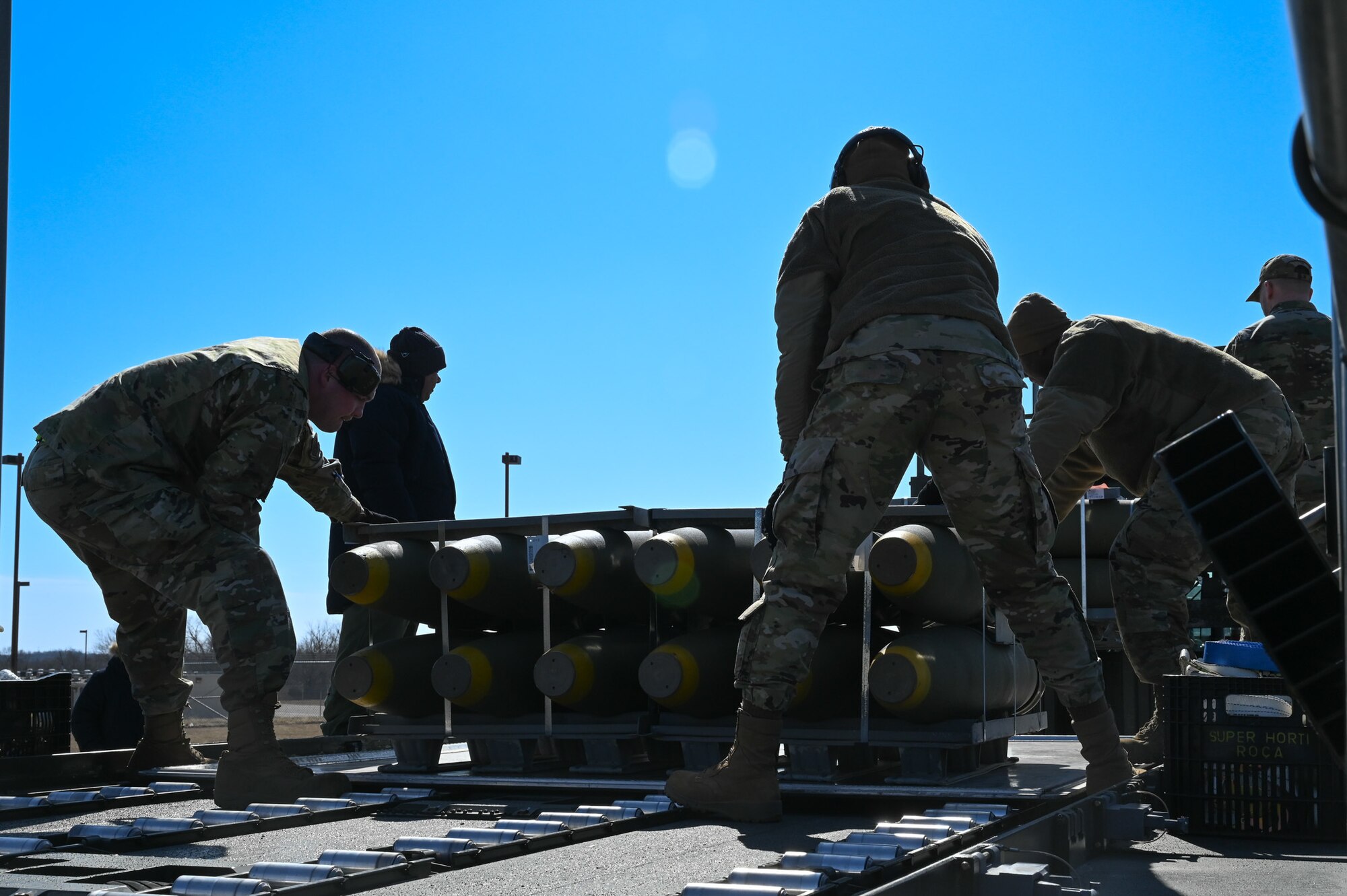 airmen loading munitions onto truck