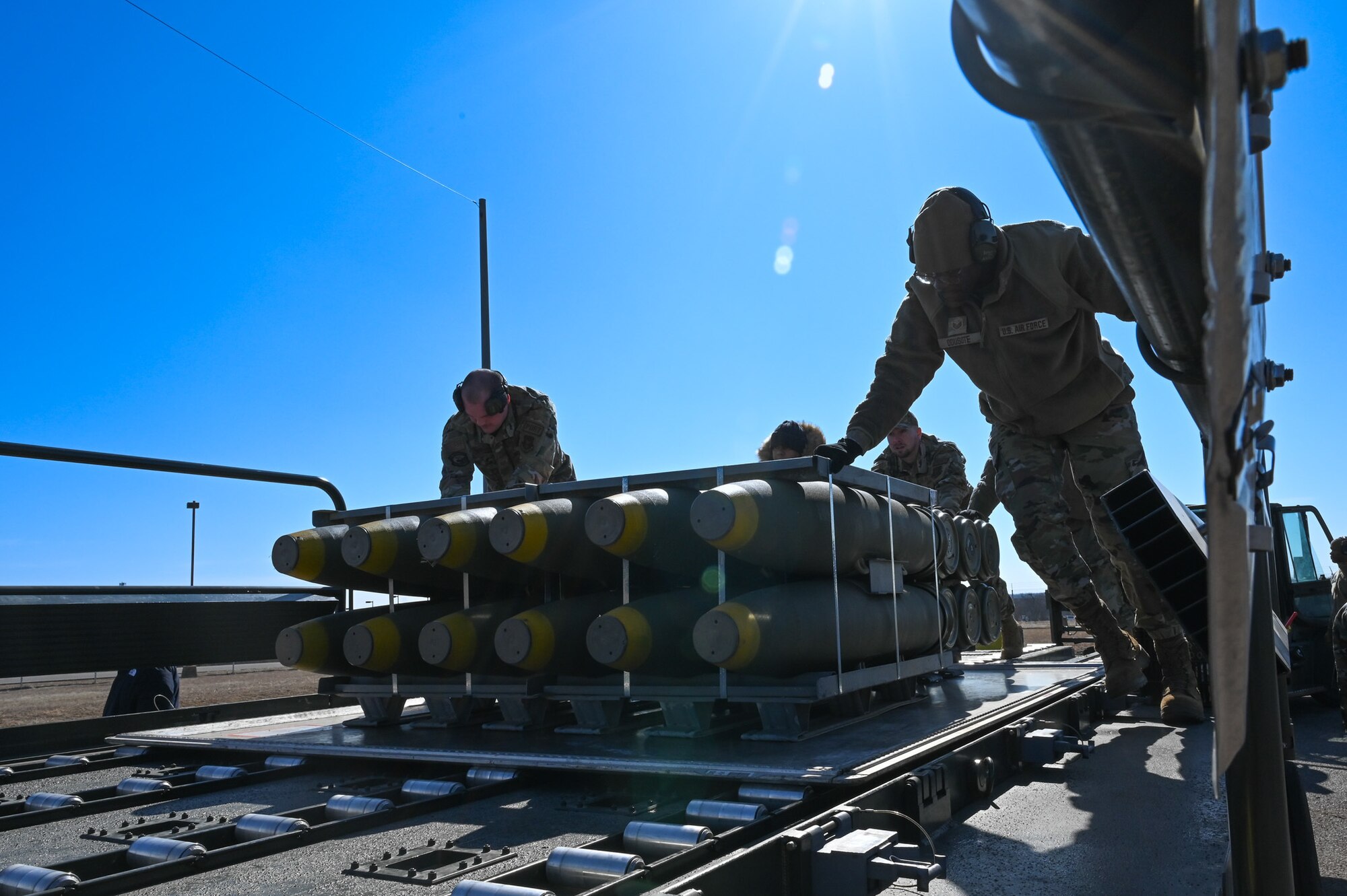 airmen loading munitions onto truck