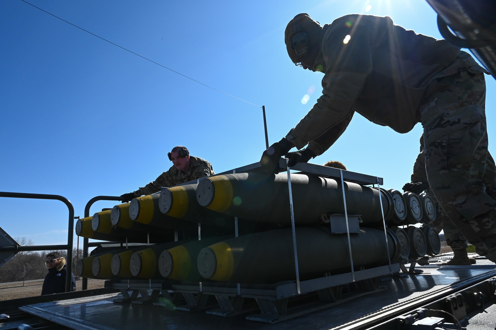 airmen loading munitions onto truck