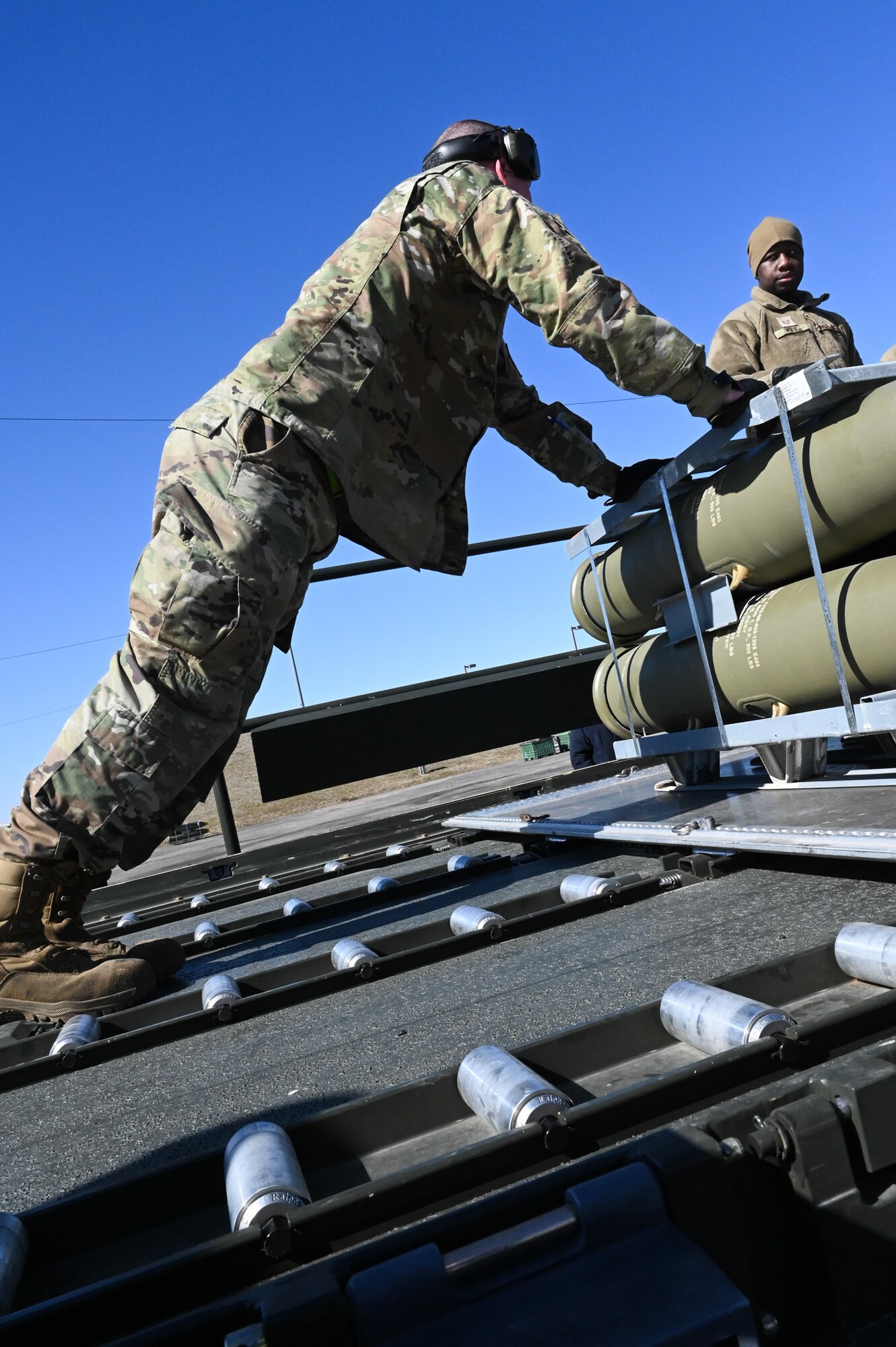 airmen loading the munitions on truck