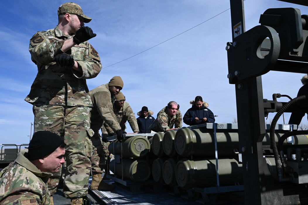 airmen loading munitions onto truck
