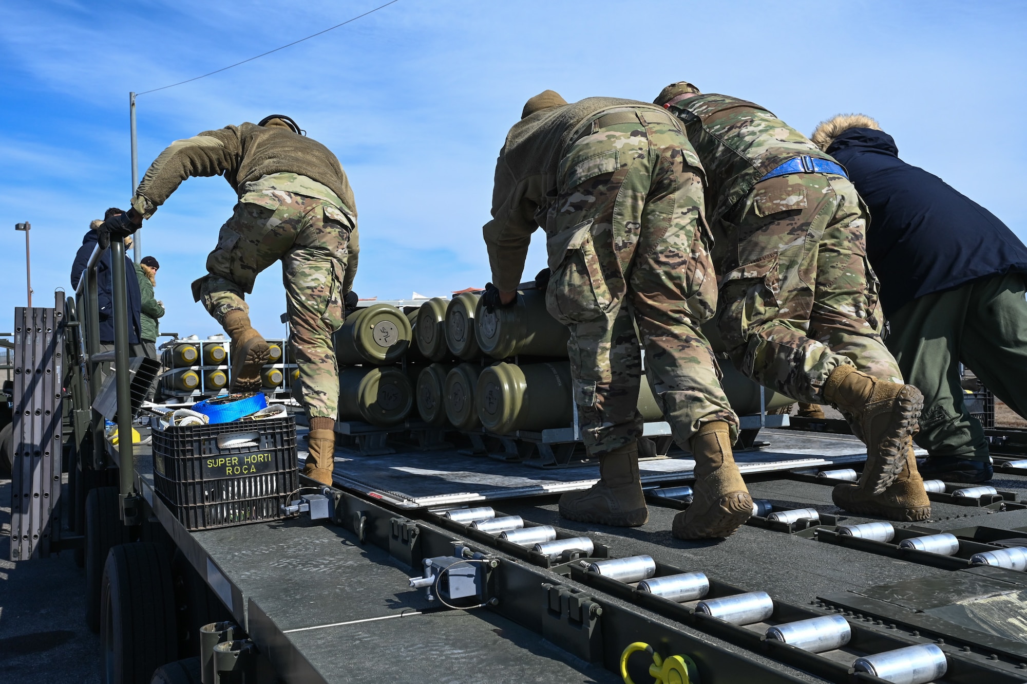 airmen loading munitions onto truck