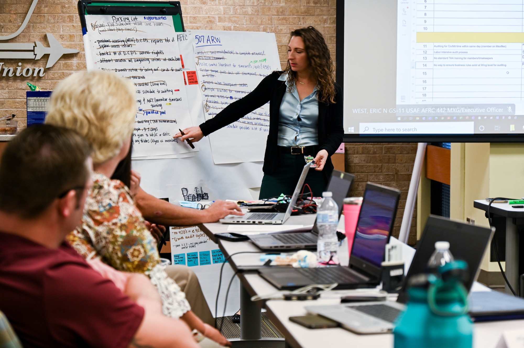 woman briefing people