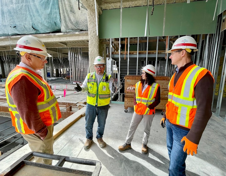 Cheree Peterson, the U.S. Army Corps of Engineers’ South Pacific Division regional business director, second from right, receives updates from Walsh Construction & Archer Western Lead Superintendent Jim Major during a walkthrough of the Spinal Cord Injury/Community Living Center construction site while visiting the Veterans Affairs San Diego Health Care System campus Feb. 17 in San Diego. They are joined here by Imad Slaiwa, LA District supervisory civil engineer, and David Van Dorpe, the South Pacific Division’s Department of Veterans Affairs Project Execution Office chief.