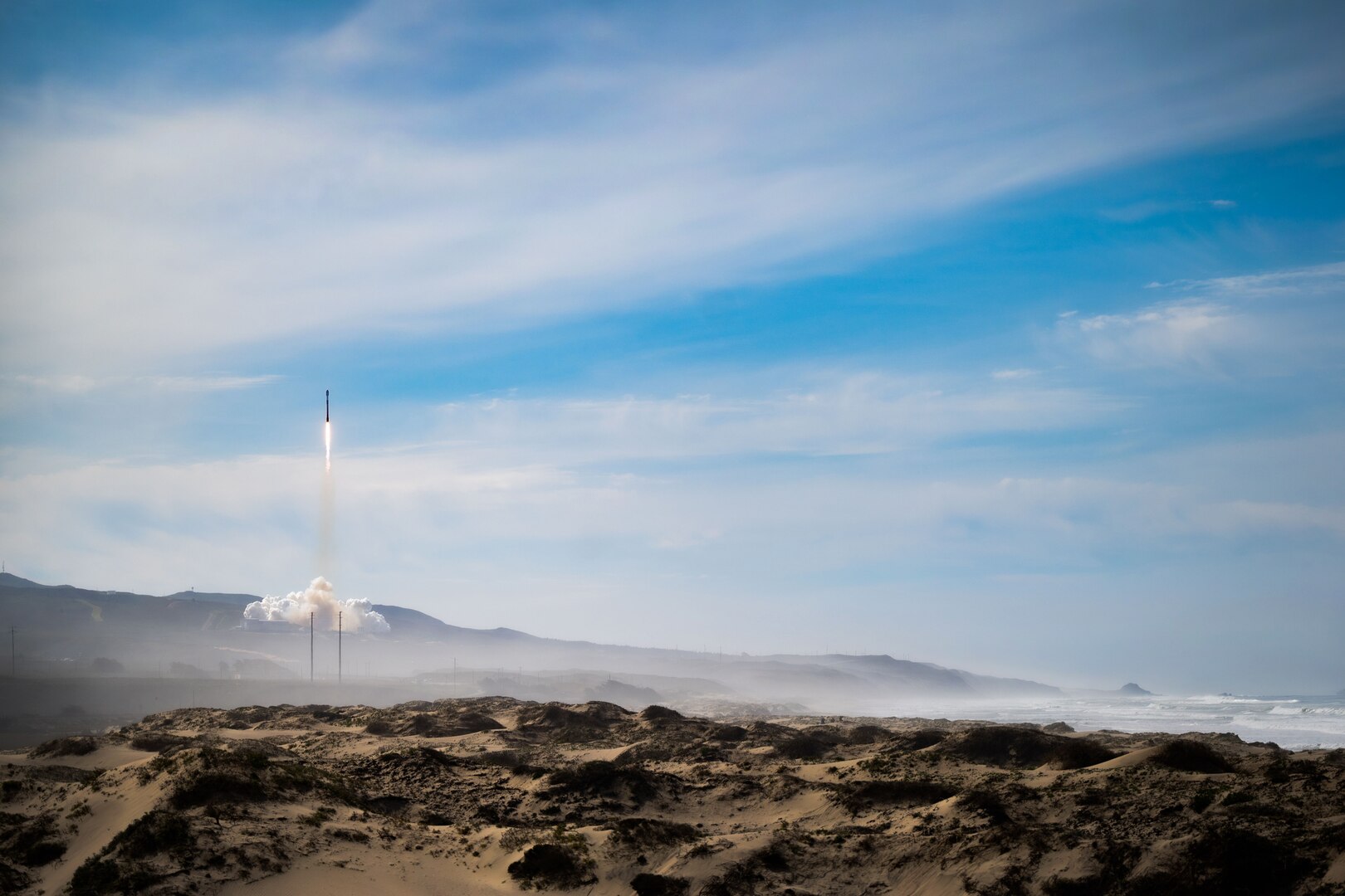 A SpaceX’s Falcon 9 Starlink rocket launches from Space Launch Complex 4 at Vandenberg Space Force Base, Calif., Feb. 17, 2023. The launch capped off a five-day immersion for Royal Air Force (RAF) Flying Officer Hallchurch, U.K. Space Operations Centre (UKSpOC) space duty officer, and RAF Corporal Coulson, UKSpOC space analyst, who travelled from RAF High Wycombe to integrate with the 18th Space Defense Squadron. (U.S. Space Force photo by Tech. Sgt. Luke Kitterman)