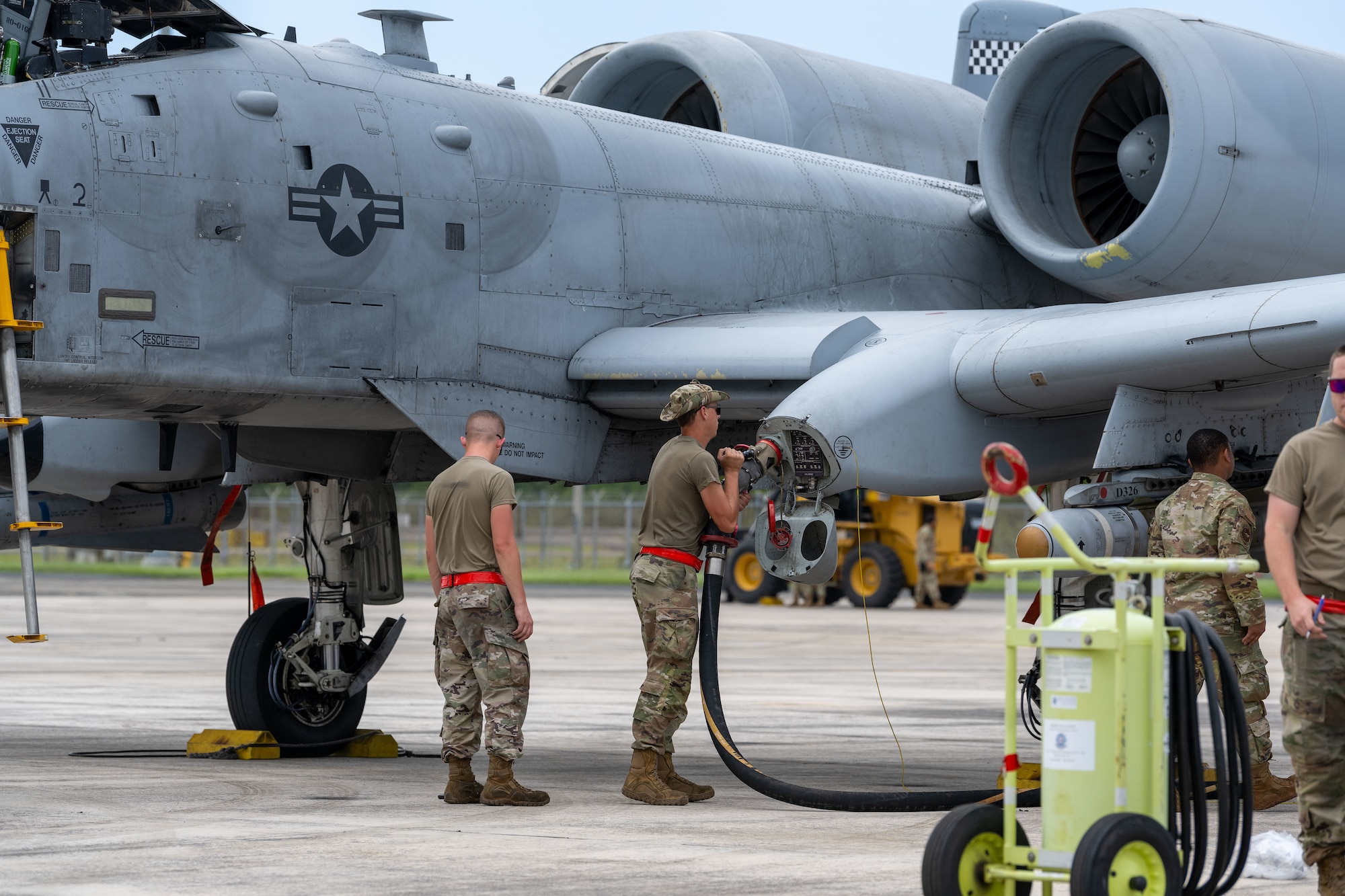 A U.S. Airman assigned to the 23rd Air Expeditionary Wing refuels an A-10C Thunderbolt II at Muniz Air National Guard Base, Carolina, Puerto Rico, Feb. 21, 2023. The Puerto Rico Air National Guard provided logistical support, command and control, airfield operations support and hangar space during Operation Forward Tiger exercise, which provides joint training and improves readiness of U.S. and partner nation military personnel through interoperability training. (U.S. Air National Guard photo by Airman 1st Class Gisselle Toro)