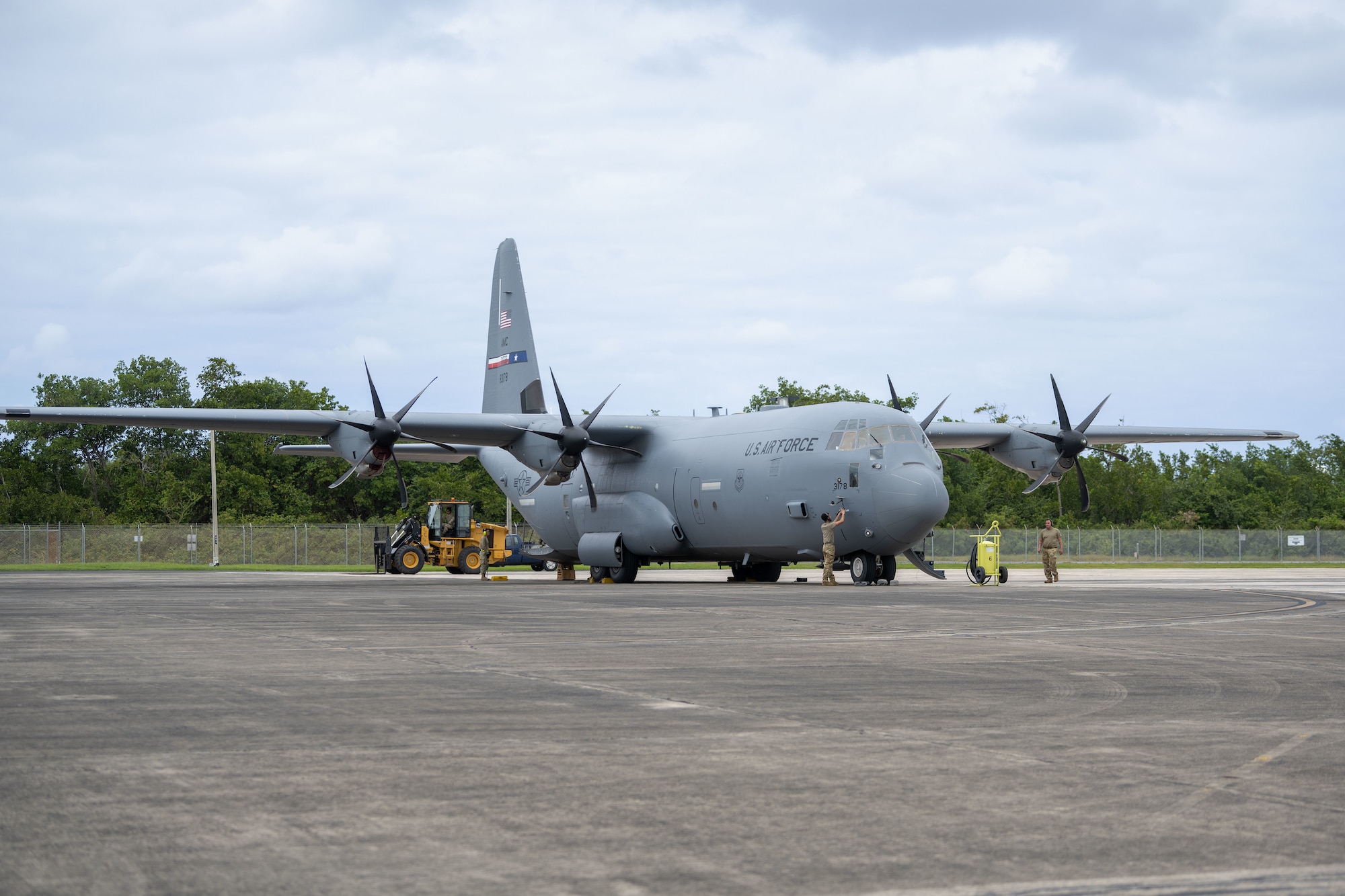 U.S. Airmen perform cargo off loading procedures on a C-130J Super Hercules assigned to the 317th Airlift Wing, Dyess Air Force Base, during Operation Forward Tiger exercise at Muniz Air National Guard Base, Carolina, Puerto Rico, Feb. 21, 2023. The Puerto Rico Air National Guard provided logistical support during this training exercise where  airmen will partner with Dominican Republic, Jamaica and Canadian Forces to enhance the humanitarian assistance and disaster relief mission throughout the Caribbean.  (U.S. Air National Guard photo by Airman 1st Class Gisselle Toro)