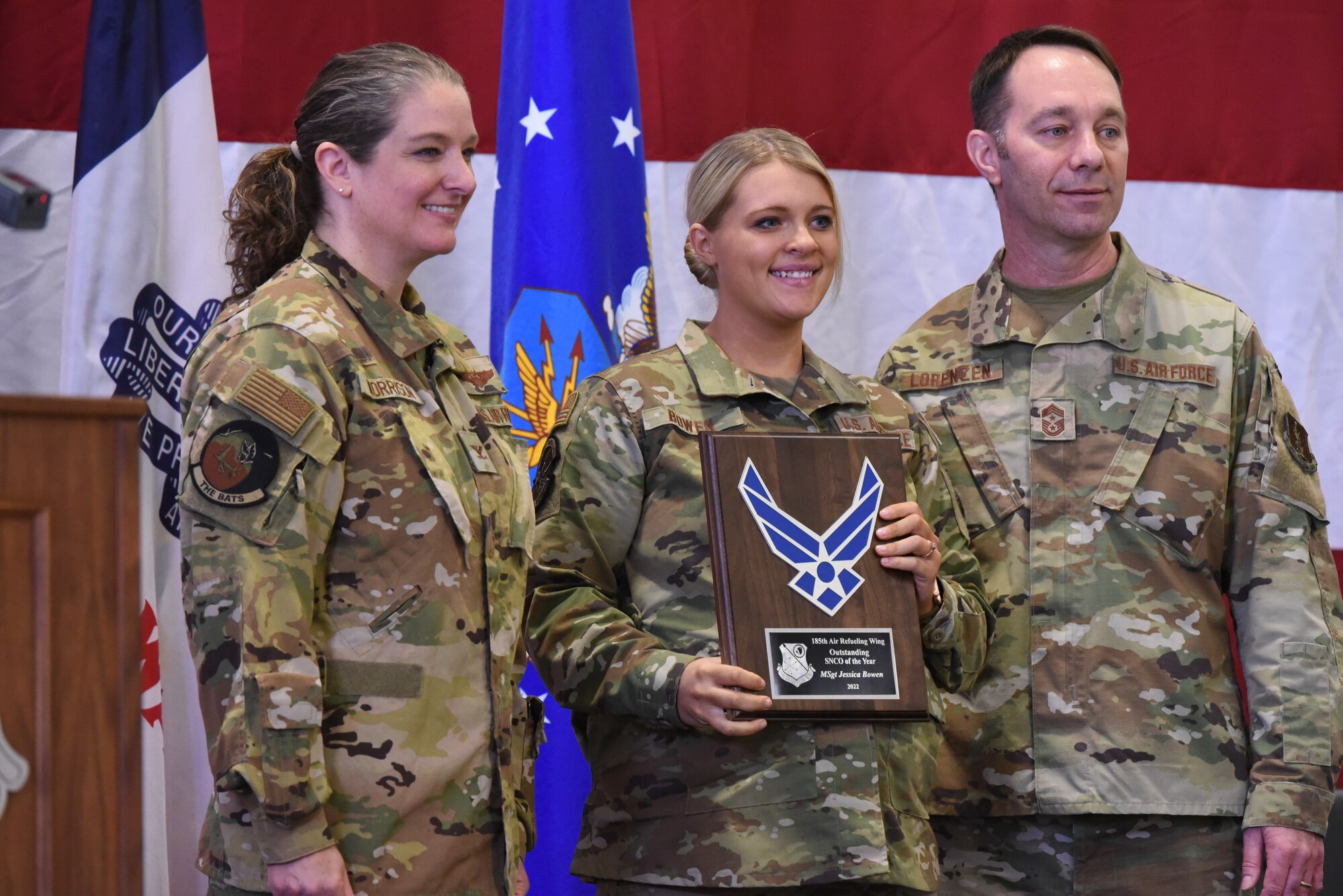 Master Sgt. Jessica Bowen poses with plaque for a photo