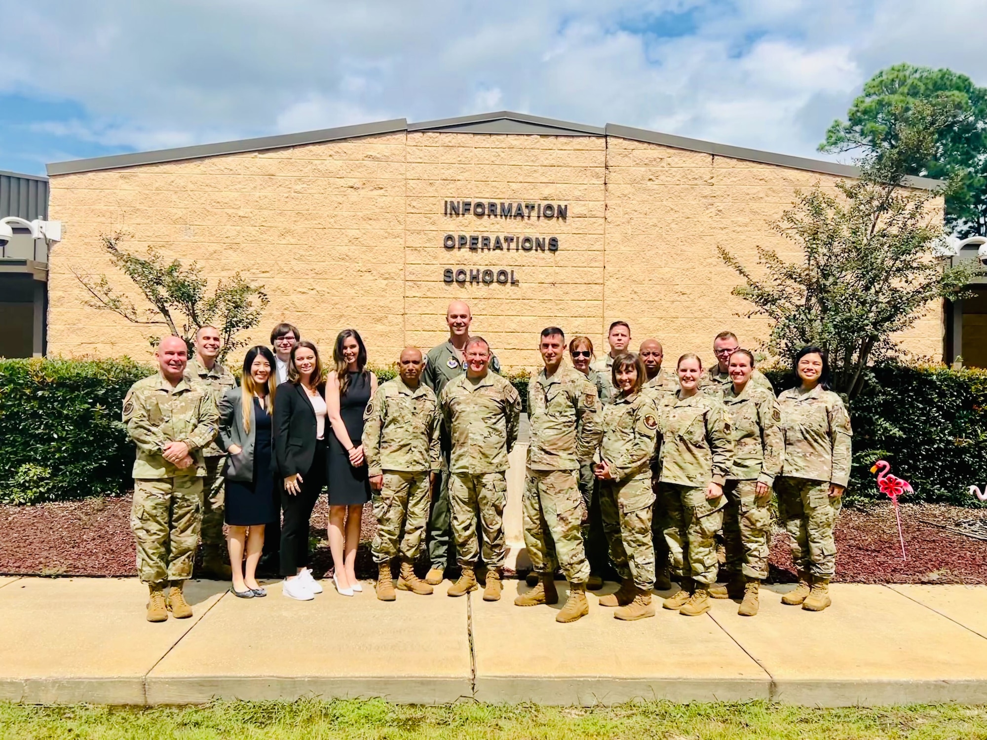 Members of the 39th Information Operations Squadron and 717th Information Operations Squadron pose for a photo with members of the Total Force Integration team.