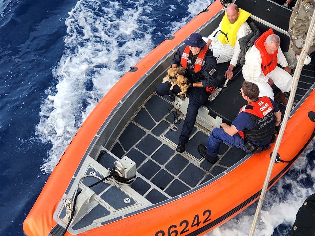 A Coast Guard Cutter Resolute small boat crew transfers Cubans to the Cutter Paul Clark for repatriation to Cuba, off the Florida Straits, March 4, 2023. The people were repatriated on March 5, 2023. (U.S. Coast Guard photo by Cutter Resolute's crew)