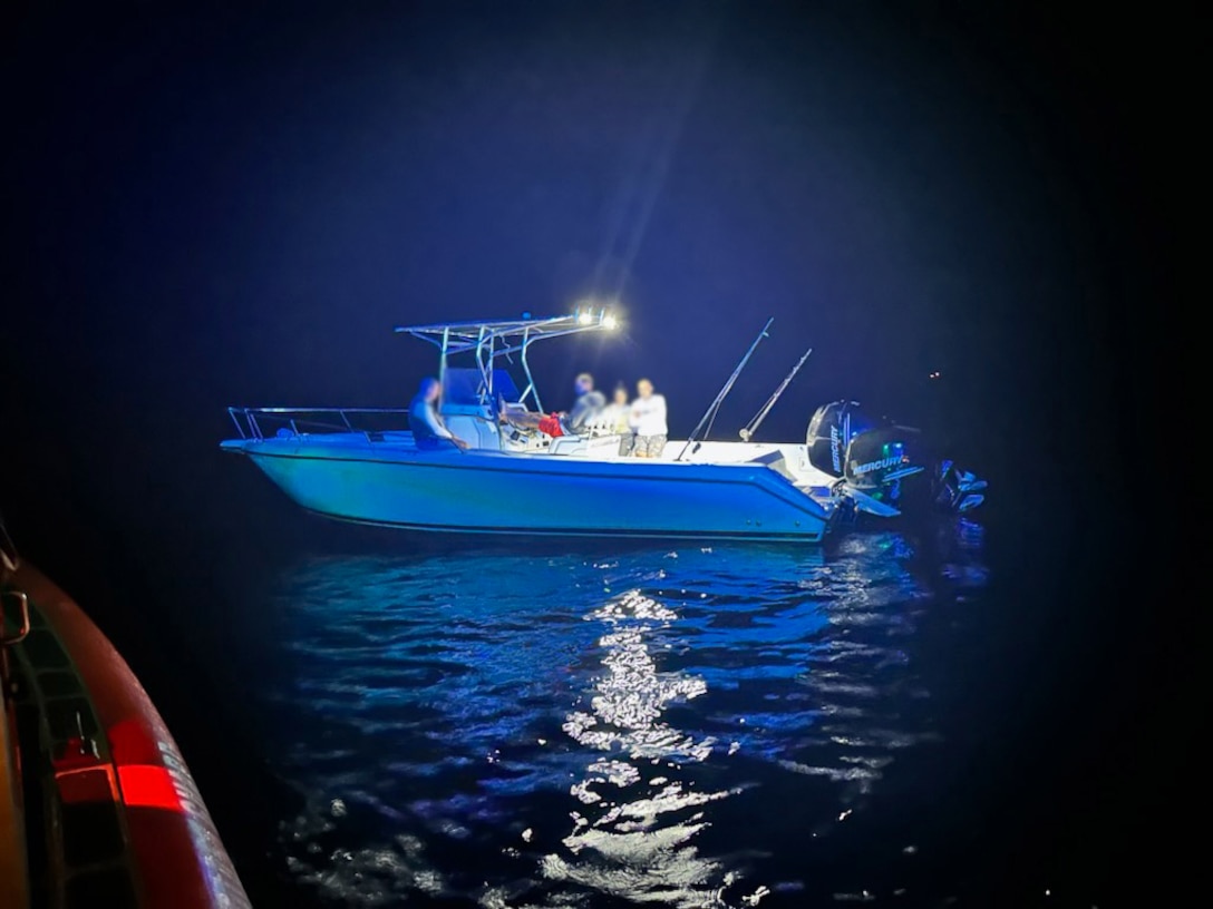 A Coast Guard Station Marathon law enforcement crew stops this vessel from illegally landing in the U.S., March 1, 2023, off Elbow Cay, Bahamas. The people were repatriated to Cuba on March 5, 2023. (U.S. Coast Guard photo by Station Marathon's crew)
