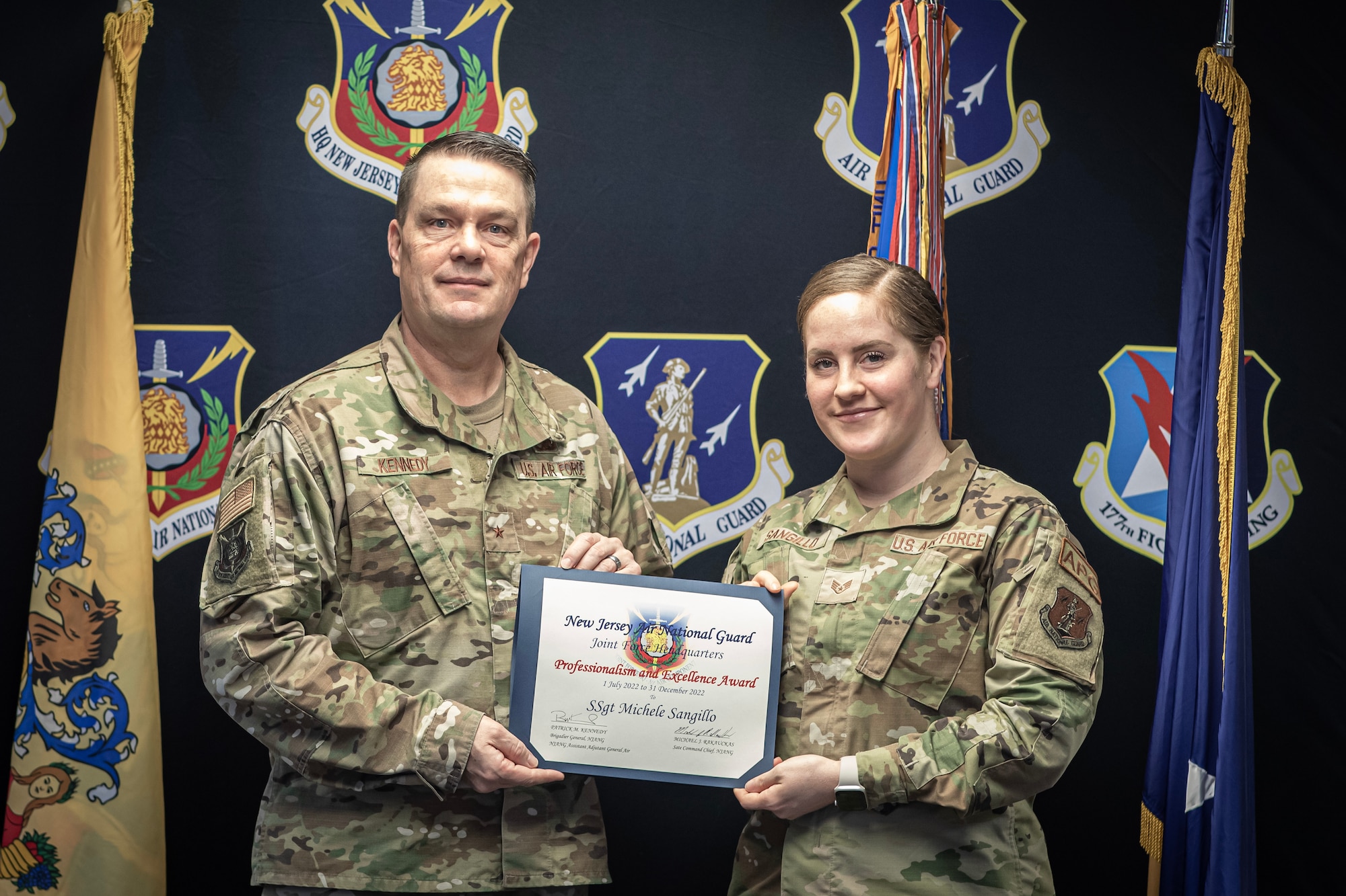 U.S. Air Force Staff Sgt. Michele Sangillo was awarded the New Jersey Air National Guard JFHQ Professionalism and Excellence Award by Brig. Gen. Patrick Kennedy, Commander of the New Jersey Air National Guard, left, on Joint Base McGuire-Dix-Lakehurst, N.J., March 4, 2023.