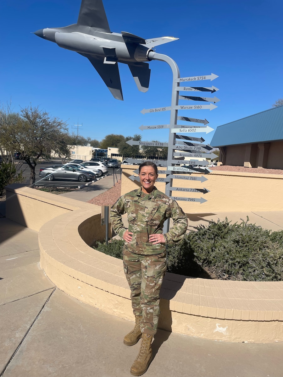 Technical Sgt. Kristie Cox poses outside her office at Morris Air National Guard Base in Tucson, Arizona. Cox was recognized as the 162nd Wing NCO of the year and  the AETC Intelligence Surveillance Reconnaissance NCO of the year for 2022. (courtesy photo)