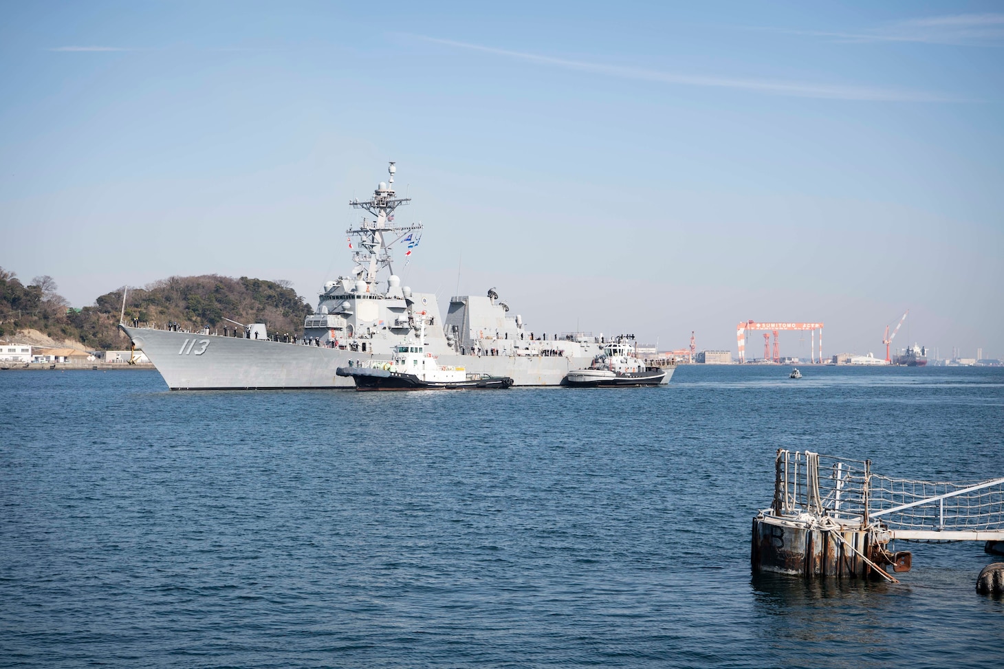 The Arleigh Burke-class guided-missile destroyer USS John Finn (DDG 113) arrives at Commander Fleet Activities Yokosuka (CFAY). Finn arrives from Naval Base San Diego to CFAY, becoming the latest forward-deployed asset in the U.S. 7th Fleet. For 75 years, CFAY has provided, maintained, and operated base facilities and services in support of the U.S. 7th Fleet's forward-deployed naval forces, tenant commands, and thousands of military and civilian personnel and their families. (U.S. Navy photo by Mass Communication Specialist 1st Class Kaleb J. Sarten)