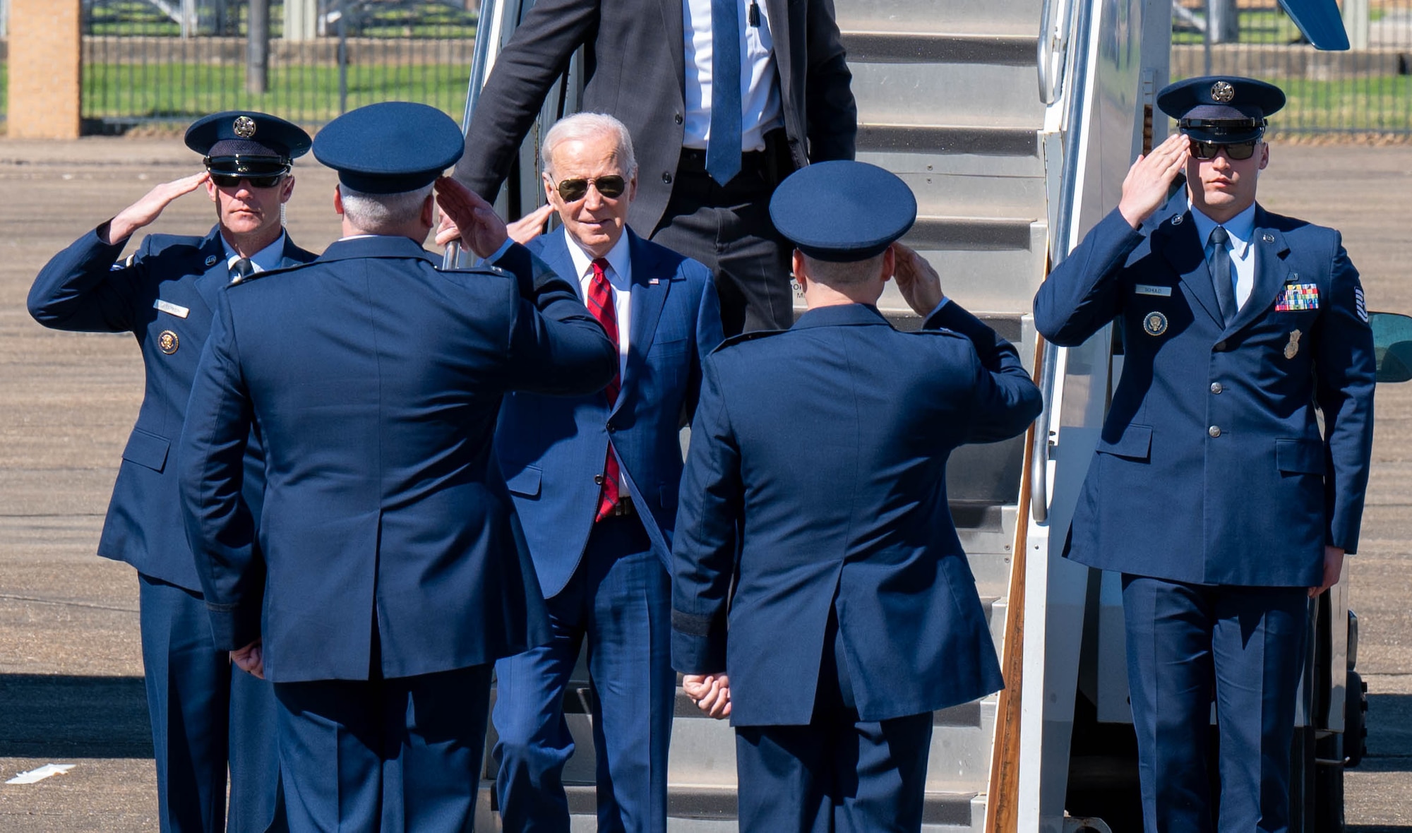 Maj. Gen. William Holt II, Air University vice commander, and Col. Christopher Ledford, 42nd Mission Support Group commander, salutes as President Joe Biden arrives on Maxwell Air Force Base, Ala., March 5, 2023. President Joe Biden visited Alabama to commemorate the 58th anniversary of Bloody Sunday.  On March 7, 1965, civil rights demonstrators marched from Selma to Montgomery. As the marchers crossed the Edmund Pettus Bridge in Selma, they were stopped and beaten by state troopers. The day became known as Bloody Sunday.