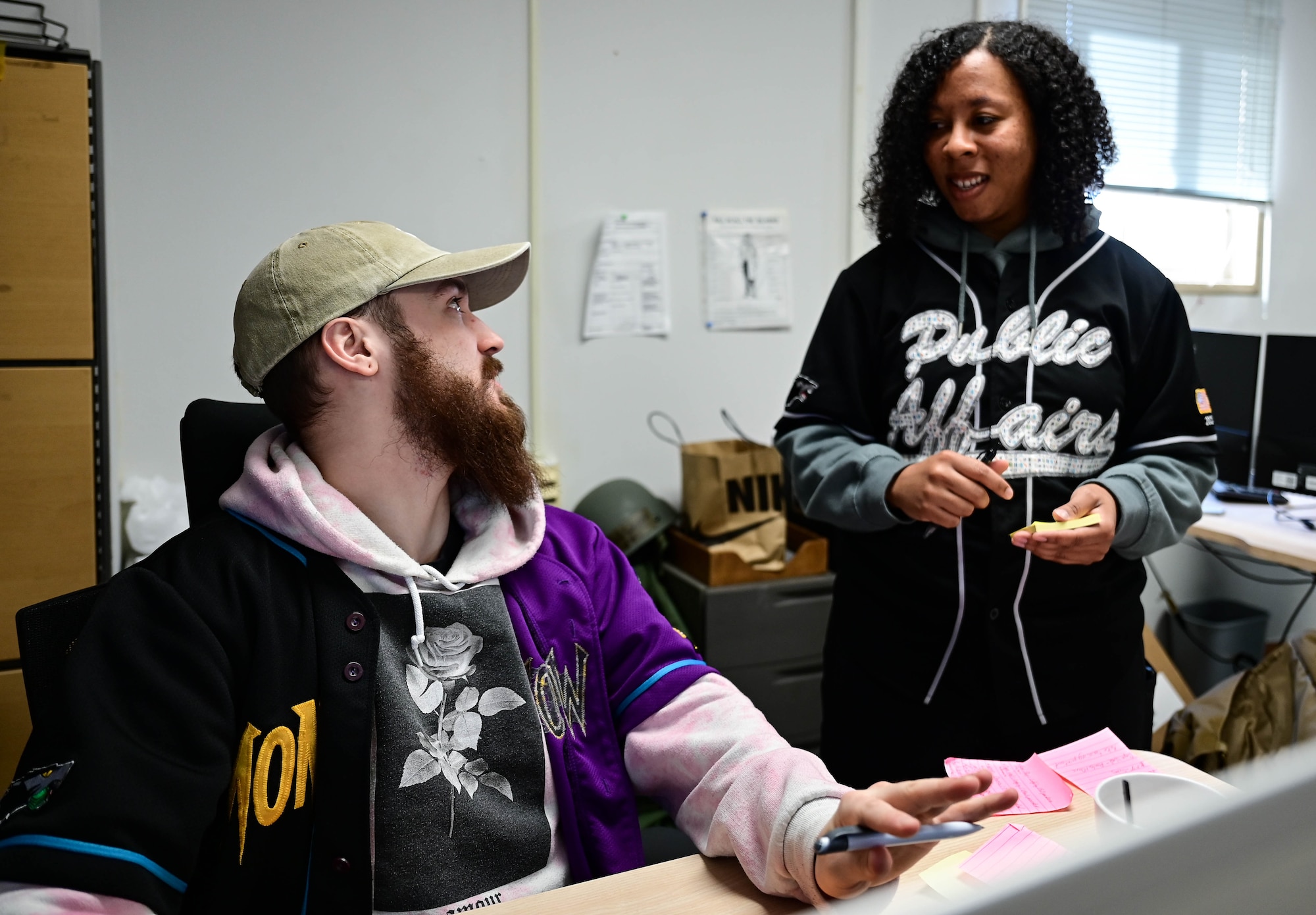 Senior Airman Calvin Cook (left), 8th Comptroller Squadron financial operations technician, assists Staff Sgt. Sadie Colbert, 8th Fighter Wing public affairs specialist, with Defense Travel System questions at Kunsan Air Base, Republic of Korea, Feb. 23, 2023.