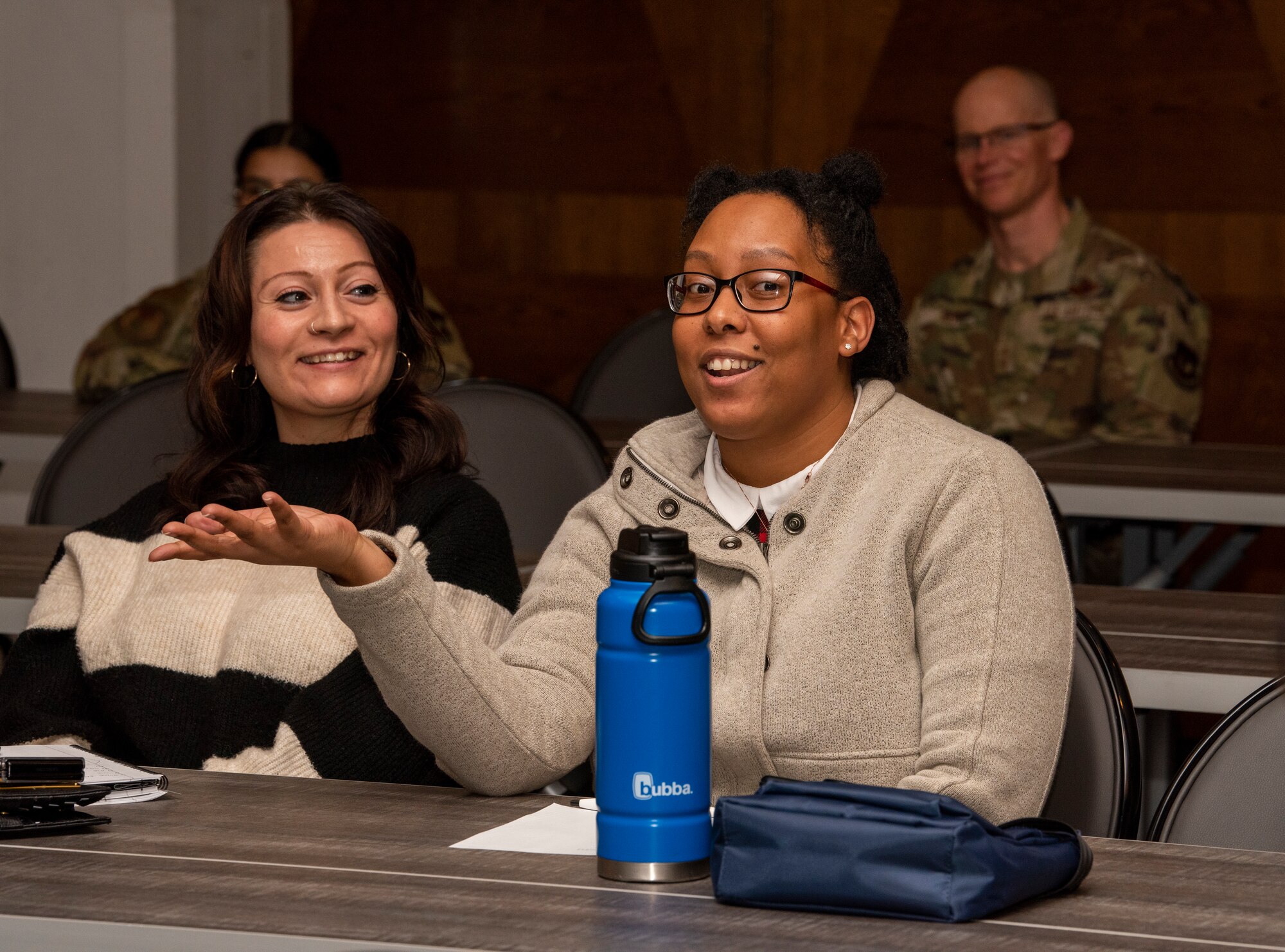 Individuals having a discussion during a seminar.