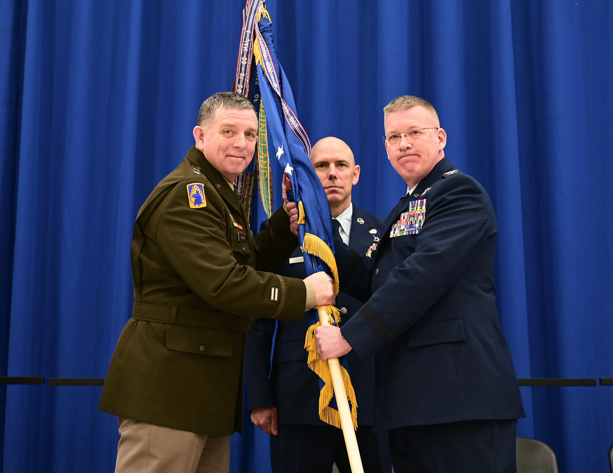 U.S. Air Force Col. James Cleet, right, relinquishes command of the 133rd Airlift Wing to U.S. Army Maj. Gen. Shawn Manke, Adjutant General, Minnesota National Guard, in St. Paul, Minn., March 4, 2023.