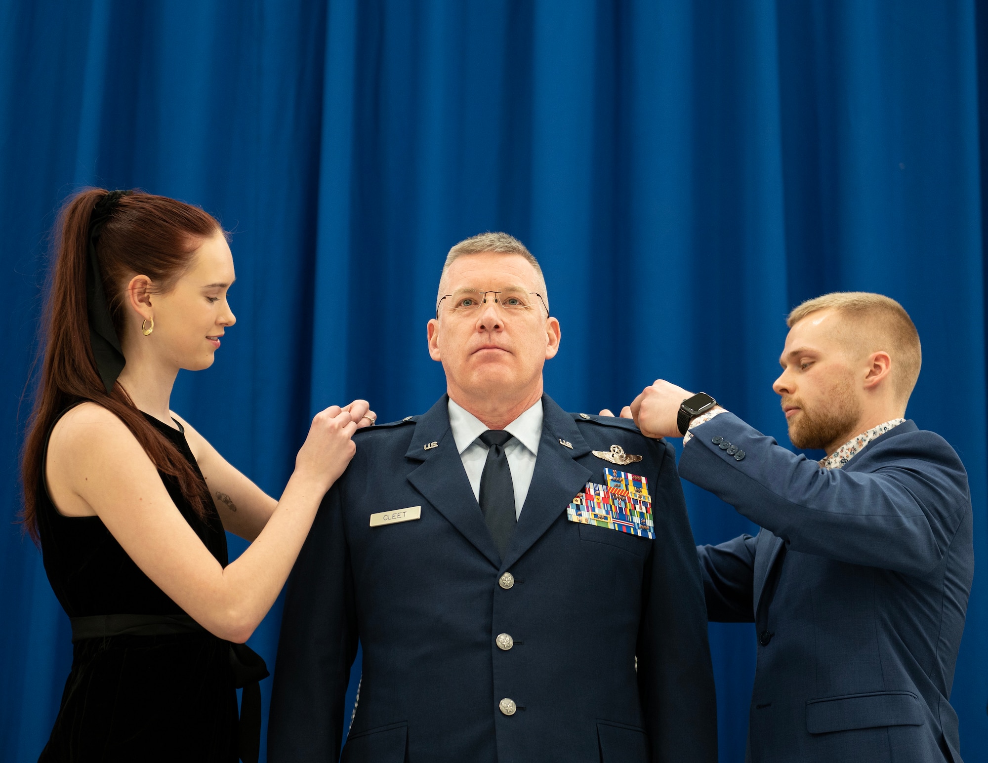 U.S. Air Force Col. James Cleet’s daughter and son pin on the rank of brigadier general in St. Paul, Minn., March 4, 2023.
