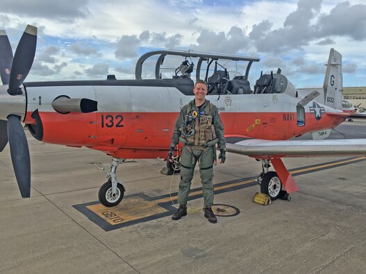 Lt. Cmdr. David Rozovski stands by a T-6B after completing his solo flight during primary flight training at Naval Air Station Corpus Christi, Texas, in June 2016.