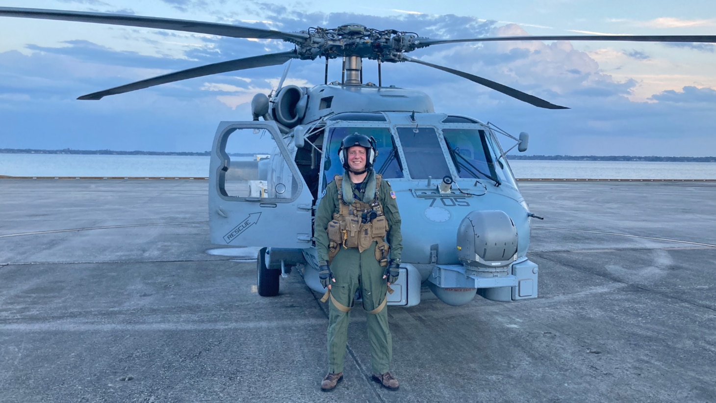 Lt. Cmdr. David Rozovski poses for a picture following his last flight in the MH-60R Seahawk marking the completion of his fleet utilization tour at Naval Air Station Jacksonville, Florida, in February 2021.