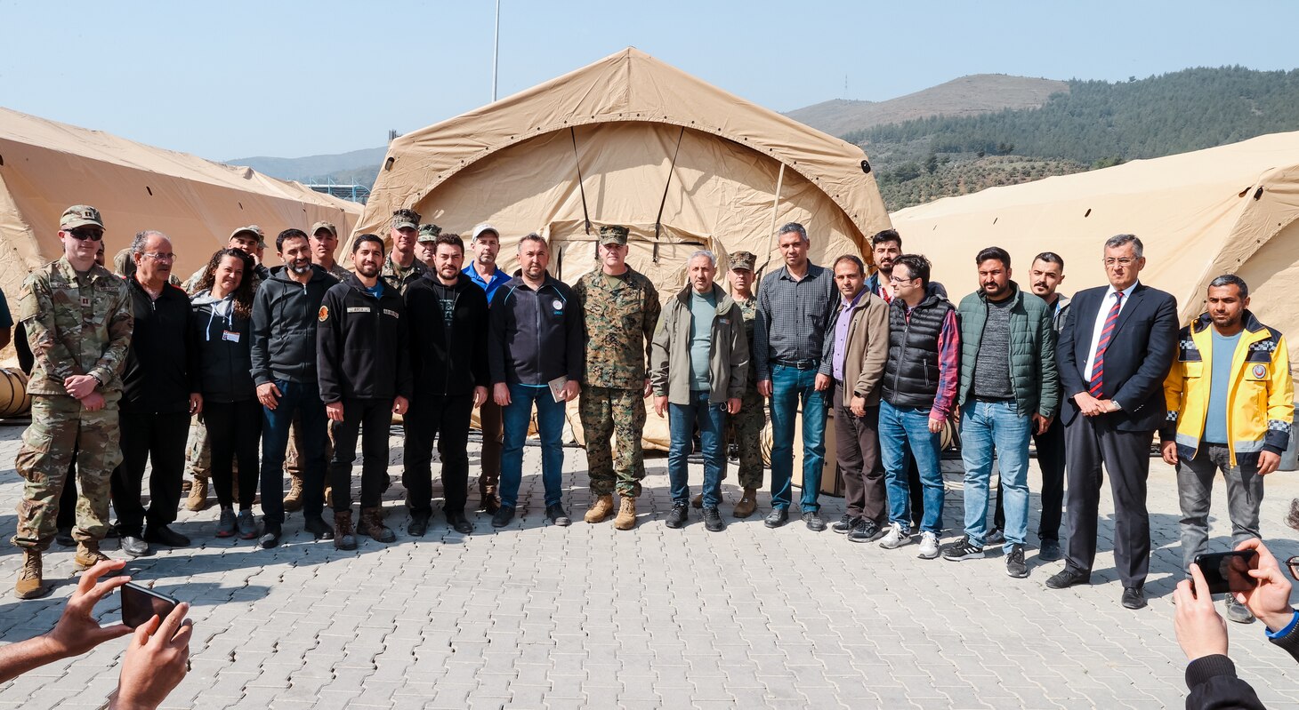 Brigadier Gen. Andrew T. Priddy, commanding general, Task Force 61/2, leadership from Task Force 61/2, and members of the Turkish Ministry of Health pose for a photo at Antakya, Türkiye, March 2, 2023. At the request of the Turkish government, U.S. military personnel assigned to Task Force 61/2 and 39th Air Base Wing were tasked with building a field hospital for the citizens who were affected by the Feb. 6 earthquakes. Upon completion of their efforts on March 2, 2023, leaders from Task Force 61/2 (TF 61/2), and 39th Air Base Wing conducted a final walk-through before the Turkish Ministry of Health began operations at the field hospital.