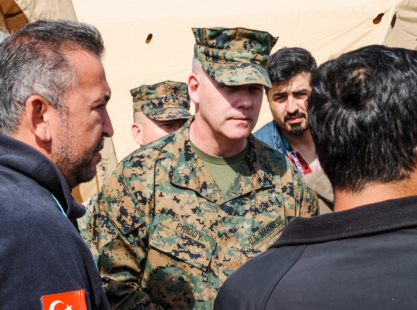 Brigadier Gen. Andrew T. Priddy, commanding general, Task Force 61/2 meets with members of the Turkish Ministry of Health, at Antakya, Türkiye, March 2, 2023. At the request of the Turkish government, U.S. military personnel assigned to Task Force 61/2 and 39th Air Base Wing were tasked with building a field hospital for the citizens who were affected by the Feb. 6 earthquakes. Upon completion of their efforts on March 2, 2023, leaders from Task Force 61/2 (TF 61/2), and 39th Air Base Wing conducted a final walk-through before the Turkish Ministry of Health began operations at the field hospital.