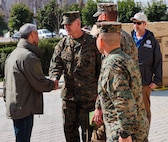 Brigadier Gen. Andrew T. Priddy, commanding general, Task Force 61/2, and a member of U.S. Agency for International Development (USAID) greet a member of the Turkish Ministry of Health, at Antakya, Türkiye, March 2, 2023. At the request of the Turkish government, U.S. military personnel assigned to Task Force 61/2 and 39th Air Base Wing were tasked with building a field hospital for the citizens who were affected by the Feb. 6 earthquakes. Upon completion of their efforts on March 2, 2023, leaders from Task Force 61/2 (TF 61/2), and 39th Air Base Wing conducted a final walk-through before the Turkish Ministry of Health began operations at the field hospital.